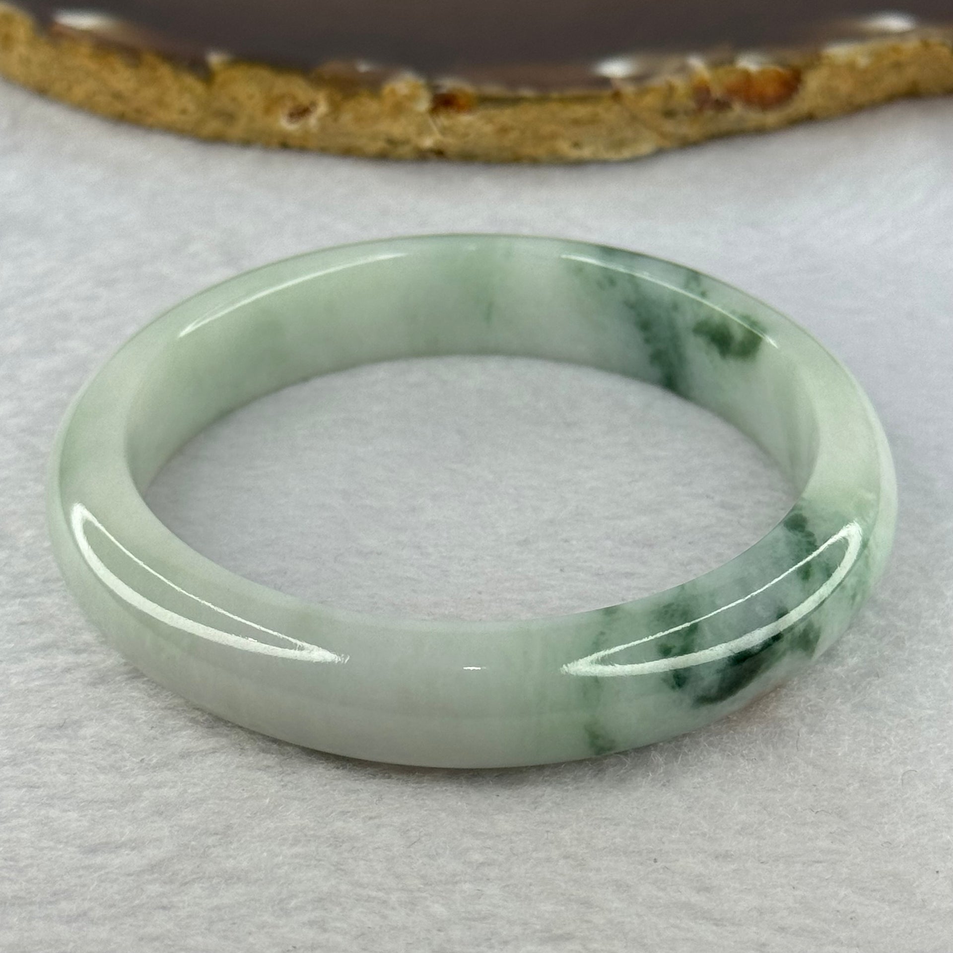 Type A Light Green with Green Piao Hua and Brown Spot Jadeite Bangle Internal Diameter 58.7mm 55.08g 12.4 by 8.5mm (Close to Perfect) - Huangs Jadeite and Jewelry Pte Ltd