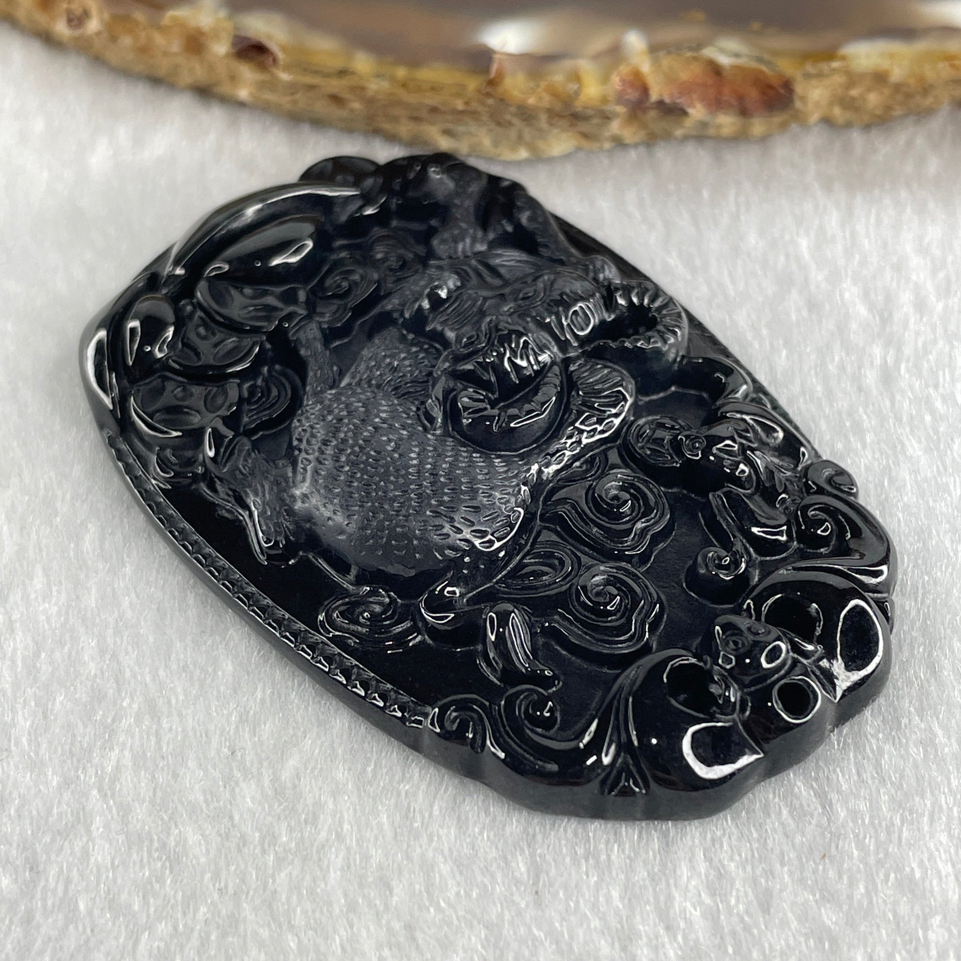 Type A Opaque to Partial Translucent Black Omphacite Jadeite Ox Pendant 20.24g 59.5 by 39.4 by 7.6mm - Huangs Jadeite and Jewelry Pte Ltd