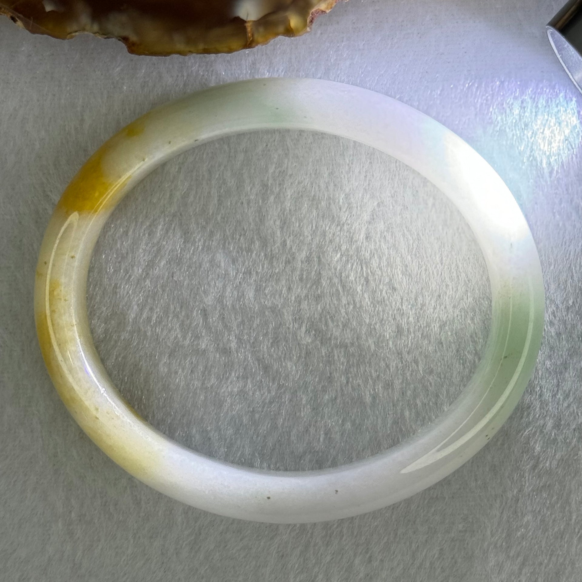 Type A Faint Lavender Green with Yellow Patches Jadeite Oval Bangle Internal Diameter 56.5mm  37.8696g 11.1 by 7.3mm (Very Slight Internal Line) - Huangs Jadeite and Jewelry Pte Ltd