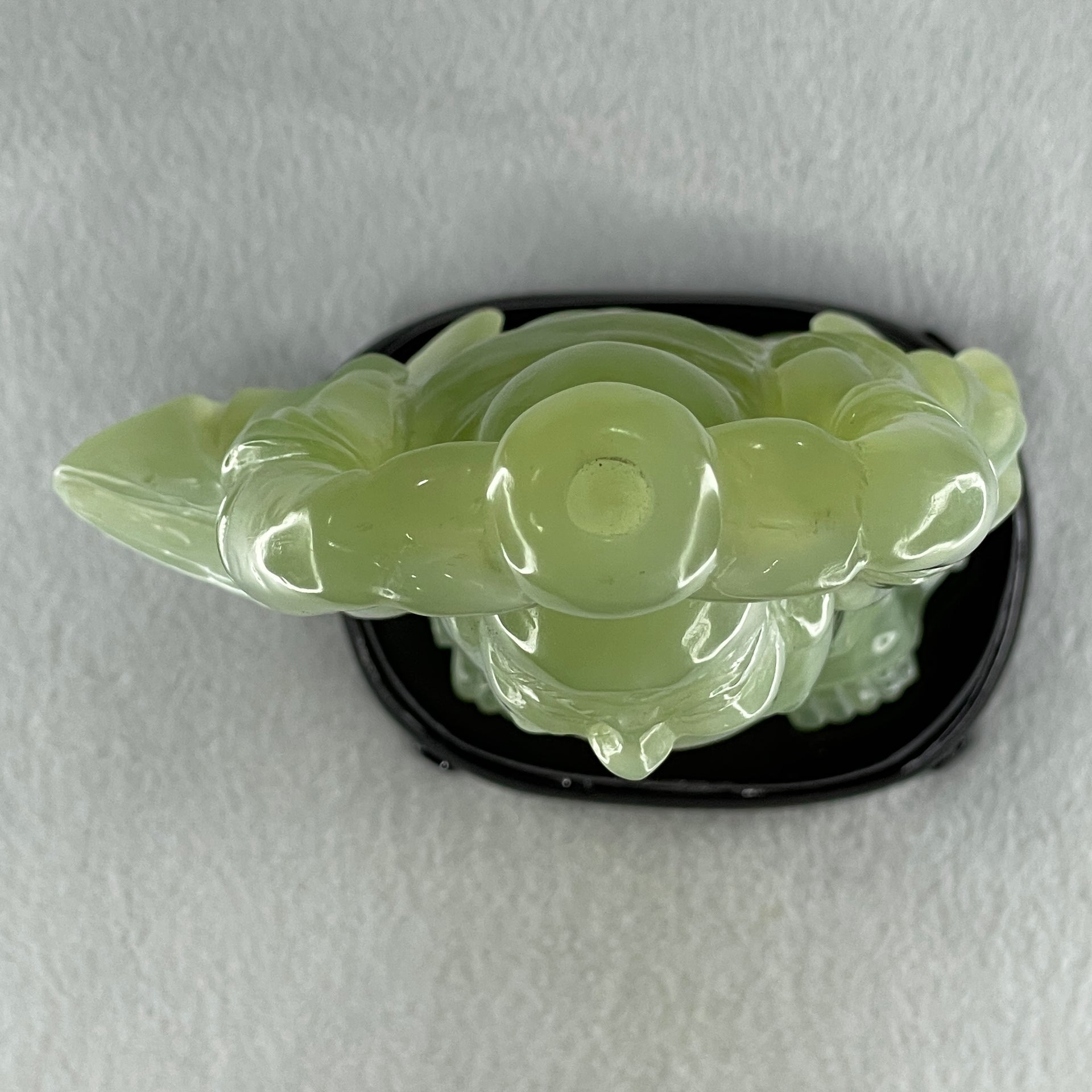 Natural Green Serpentine Stand Laughing Milo Buddha with Wealth Pot with Wooden Stand Display 1,599.3g 140.0 by 90.0 by 270.0mm - Huangs Jadeite and Jewelry Pte Ltd