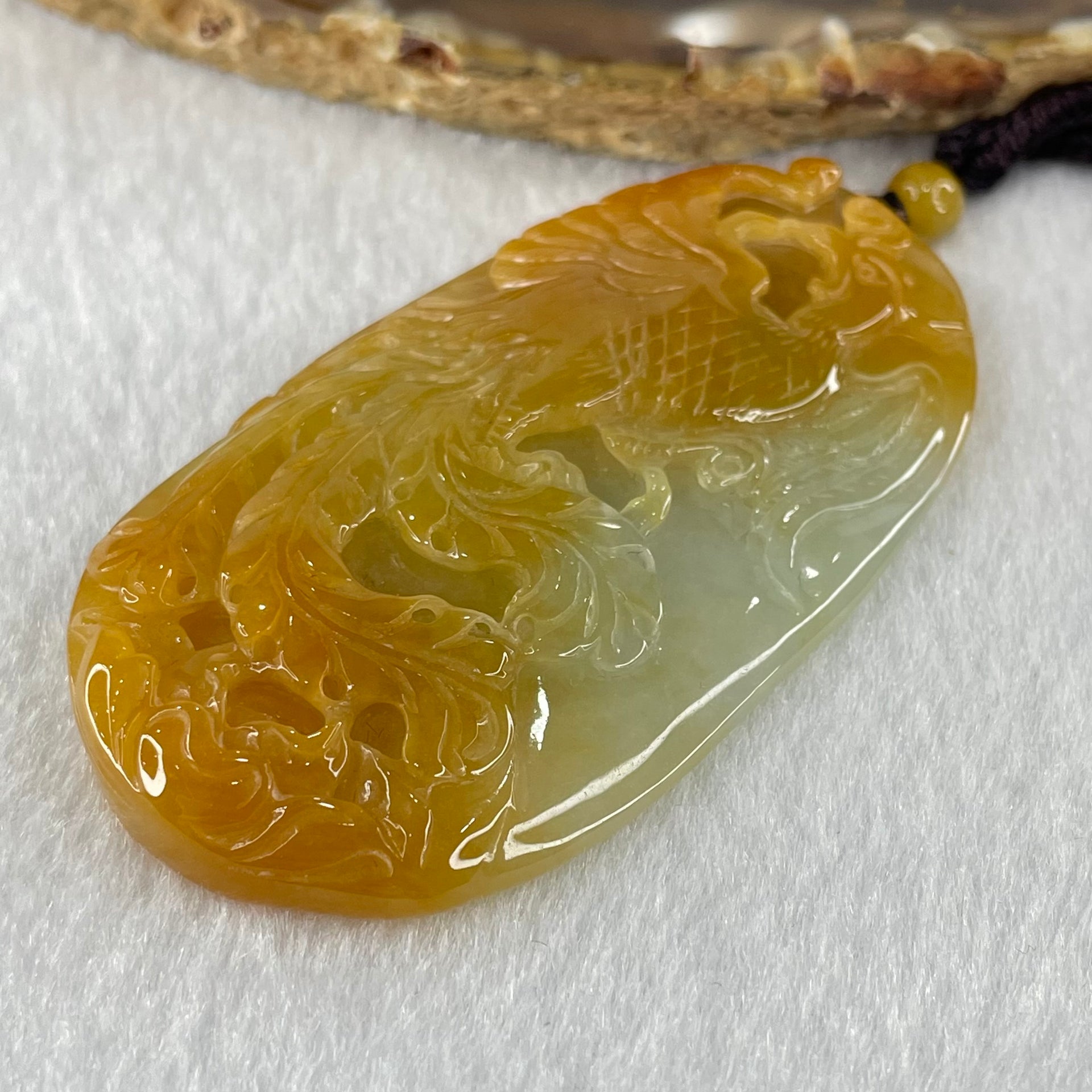 Grandmaster Type A Reddish Brown with Faint Lavender Green Jadeite Phoenix 凤戏牡丹 Pendant 41.26g 64.96 by 35.02 by 9.52mm With NGI Cert 82838779 - Huangs Jadeite and Jewelry Pte Ltd