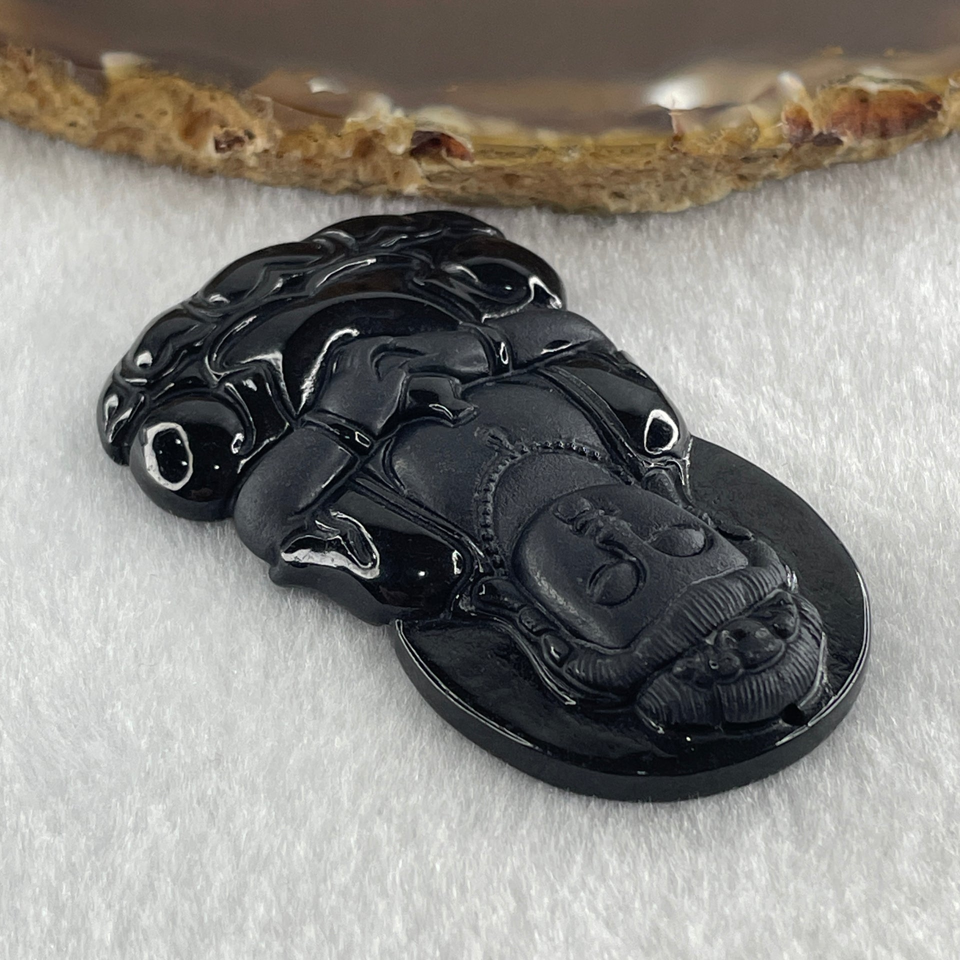 Type A Opaque to Partial Translucent Black Omphacite Jadeite Guan Yin on Dragon Pendant 36.54g 66.7 by 43.5 by 8.0mm - Huangs Jadeite and Jewelry Pte Ltd