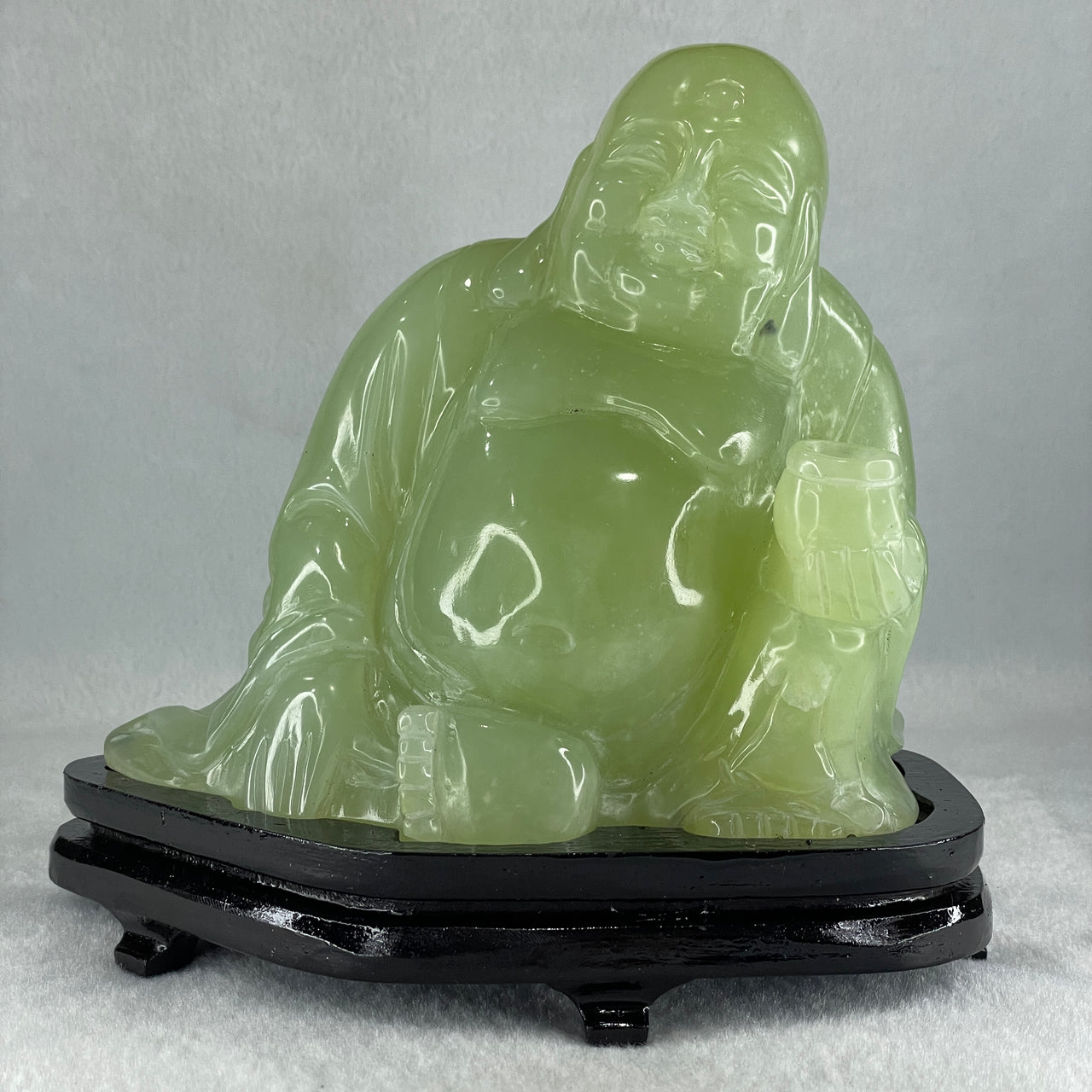 Natural Green Serpentine Siting Milo Buddha with Wealth Pot with Wooden Stand Display 1362.0g 165.0 by 110.0 by 150.0mm - Huangs Jadeite and Jewelry Pte Ltd