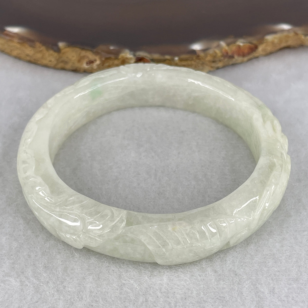 Natural Type A Jadeite Bangle | Carved Phoenix Relief Light Green (56.42g | 54.6mm Inner Diameter | 12.2 x 9.4mm) (Internal Line)