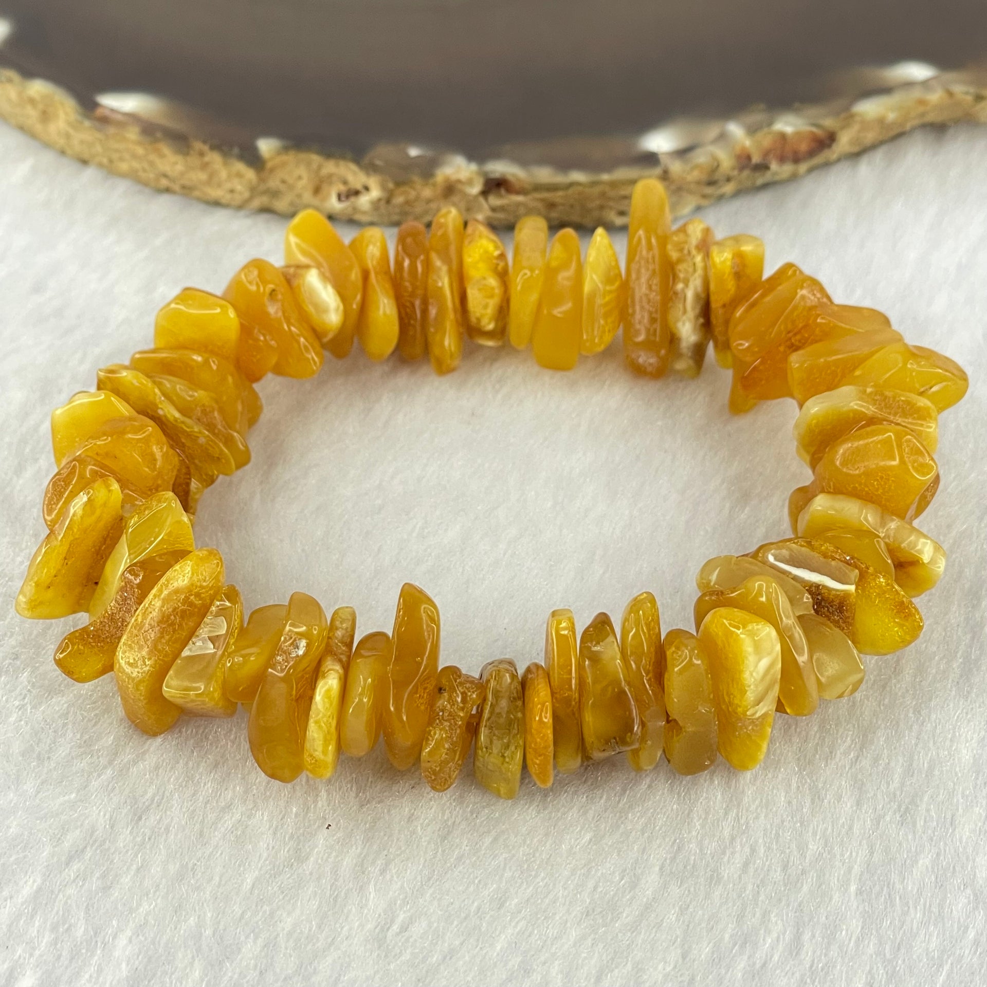 Natural Beeswax Raw Stone Irregular Beads Bracelet 天然蜜蜂蜡原石手链 22.59g 18.5cm 21.6 by 12.6 by 4.7mm, 13.1 by 11.7 by 4.8mm 54pcs - Huangs Jadeite and Jewelry Pte Ltd