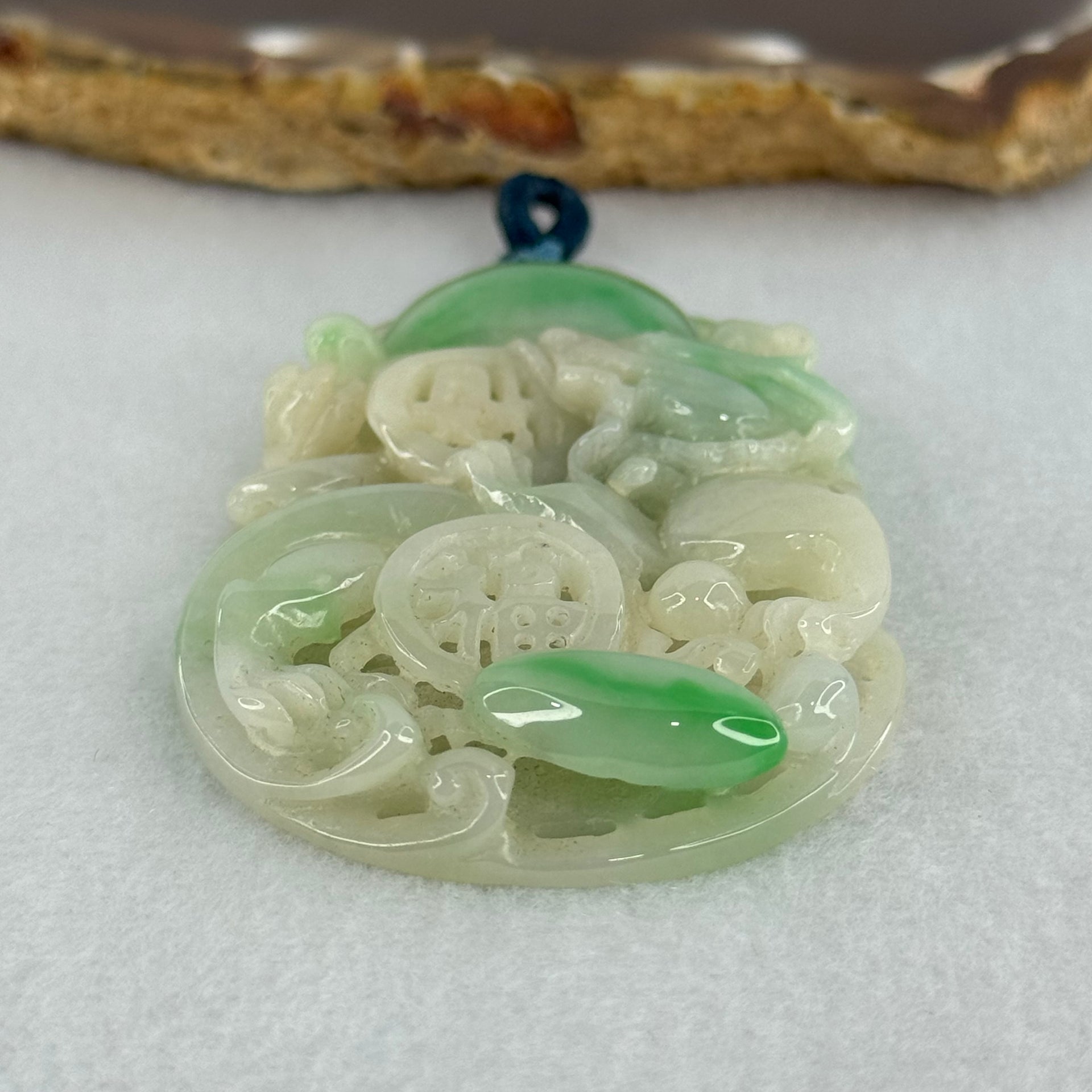 Type A Natural Light Green with Apple Green Jadeite 3D Dragon In Hollow Carving Pendant 27.58g 58.65 by 39.42 by 8.48mm with NGI Cert No. 16824716 - Huangs Jadeite and Jewelry Pte Ltd
