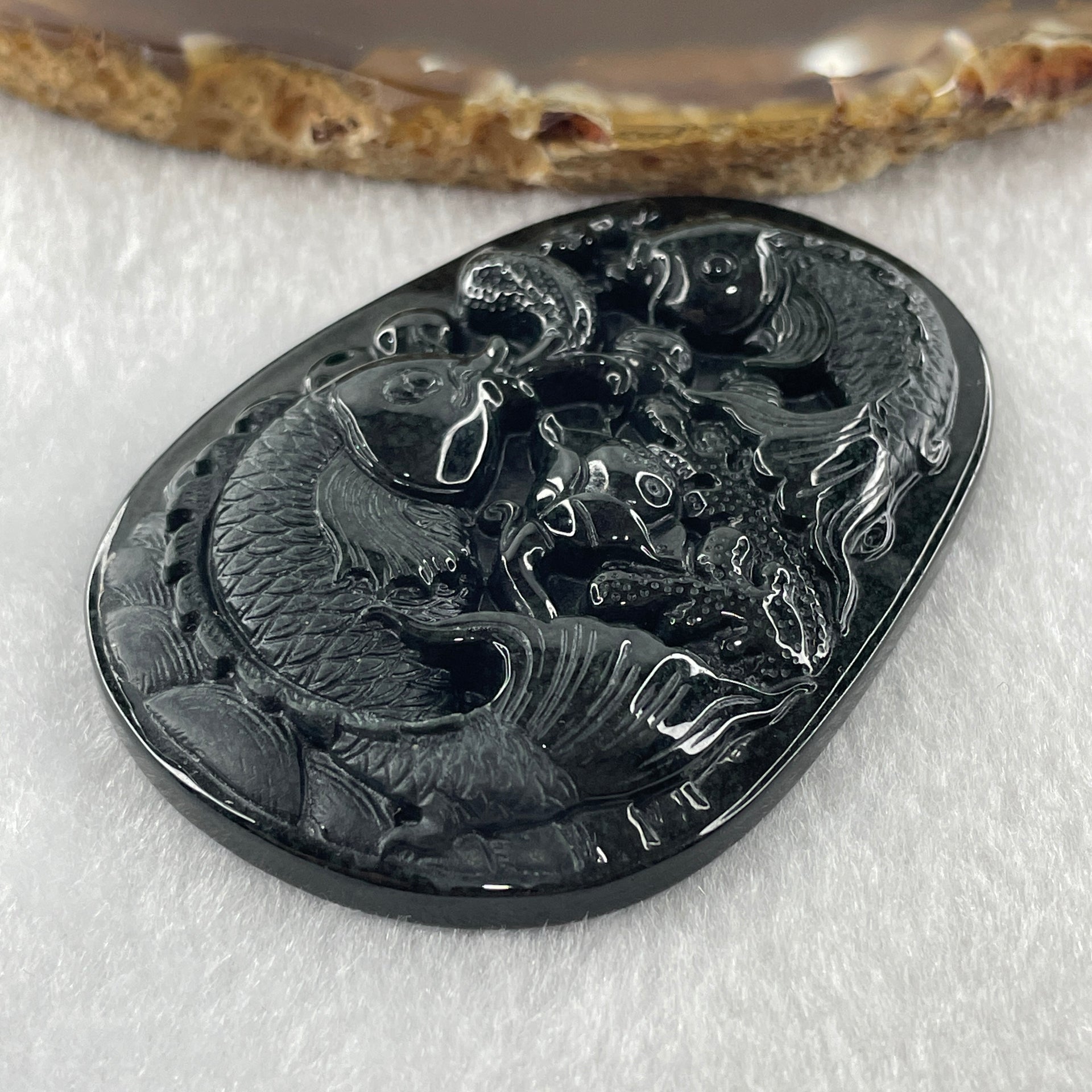 Type A Opaque to Partial Translucent Black Omphacite Jadeite Double Fish with Lotus Flower and Coins Pendant 29.11g 61.1 by 44.1 by 9.2mm - Huangs Jadeite and Jewelry Pte Ltd