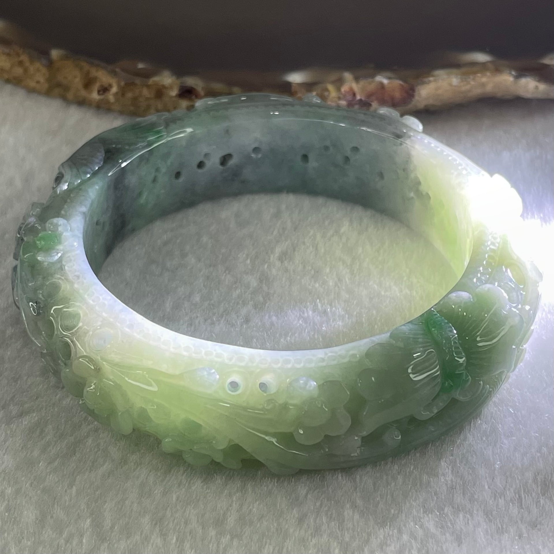 Type A Light to Dark Blueish Green Jadeite Carved with Prosperity Flowers Twin Birds and Butterfly Bangle 78.70g Internal Diameter 55.0mm 15.7 by 11.0mm - Huangs Jadeite and Jewelry Pte Ltd