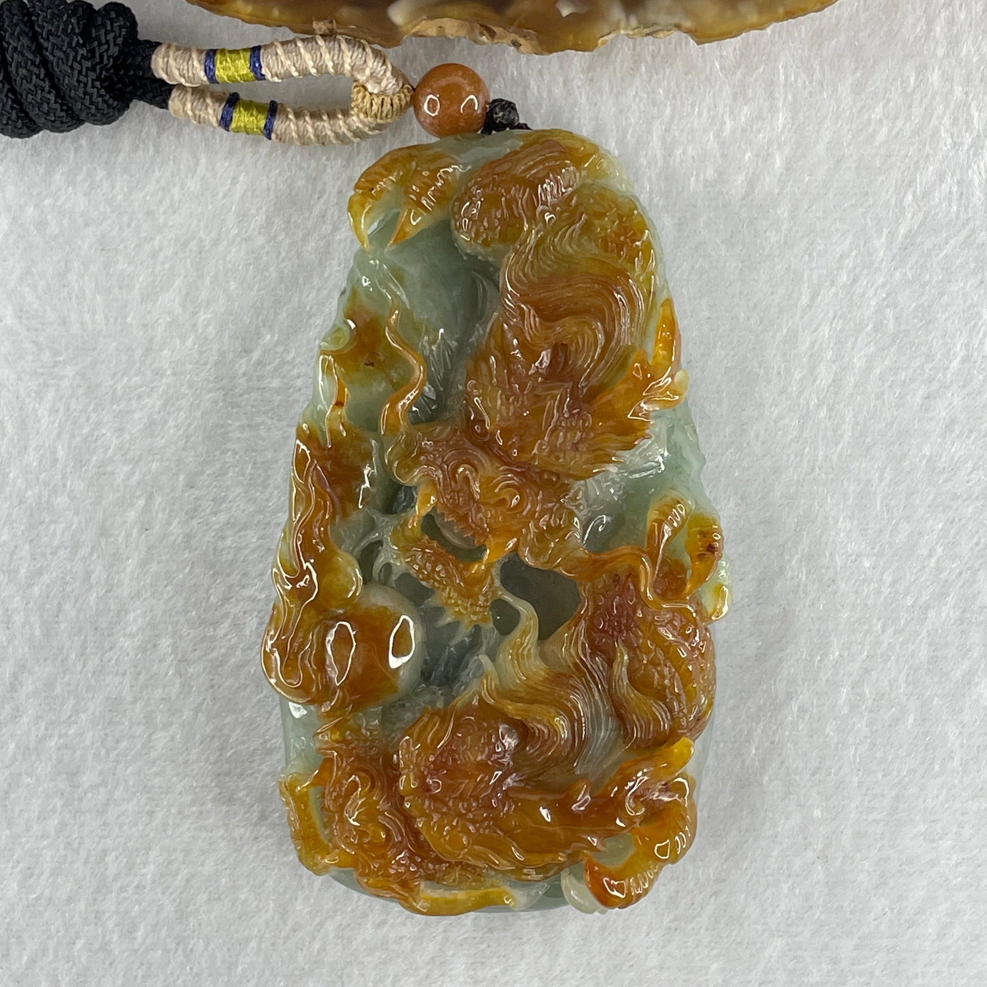 Grand Master Type A Green with Brownish Jadeite Dragon Double Side Pendant 125.78g 77.7 by 46.4 by 18.2mm - Huangs Jadeite and Jewelry Pte Ltd