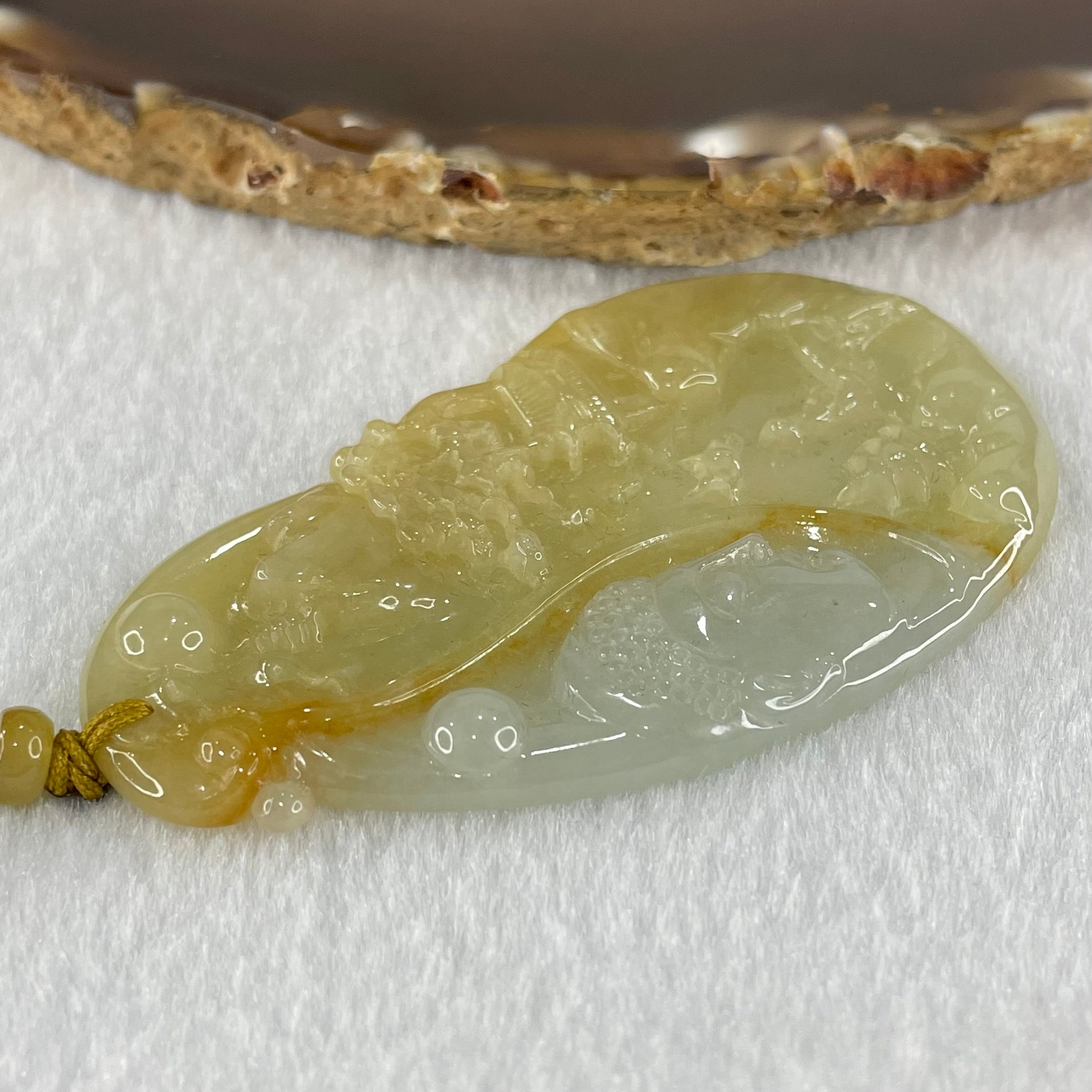 Grandmaster Type A Yellow with Faint Green and Red Jadeite Shan Shui with Buddha Pendant 22.54g 69.8 by 39.7 by 4.8mm - Huangs Jadeite and Jewelry Pte Ltd