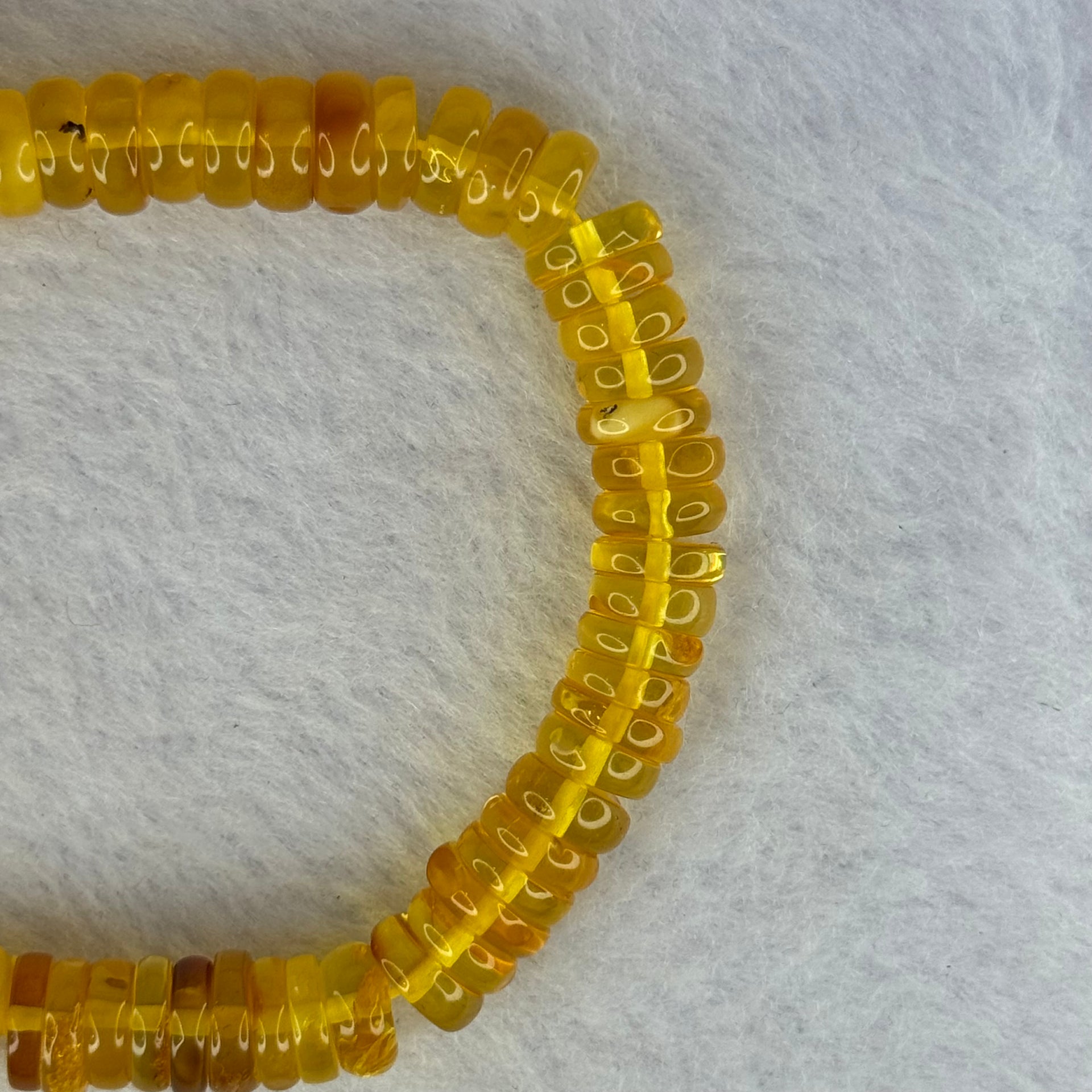 Natural Amber Ping An Kou Donut Shape Bracelet 天然琥珀手链 10.27g 16.5cm 9.2 by 3.3mm 70pcs - Huangs Jadeite and Jewelry Pte Ltd