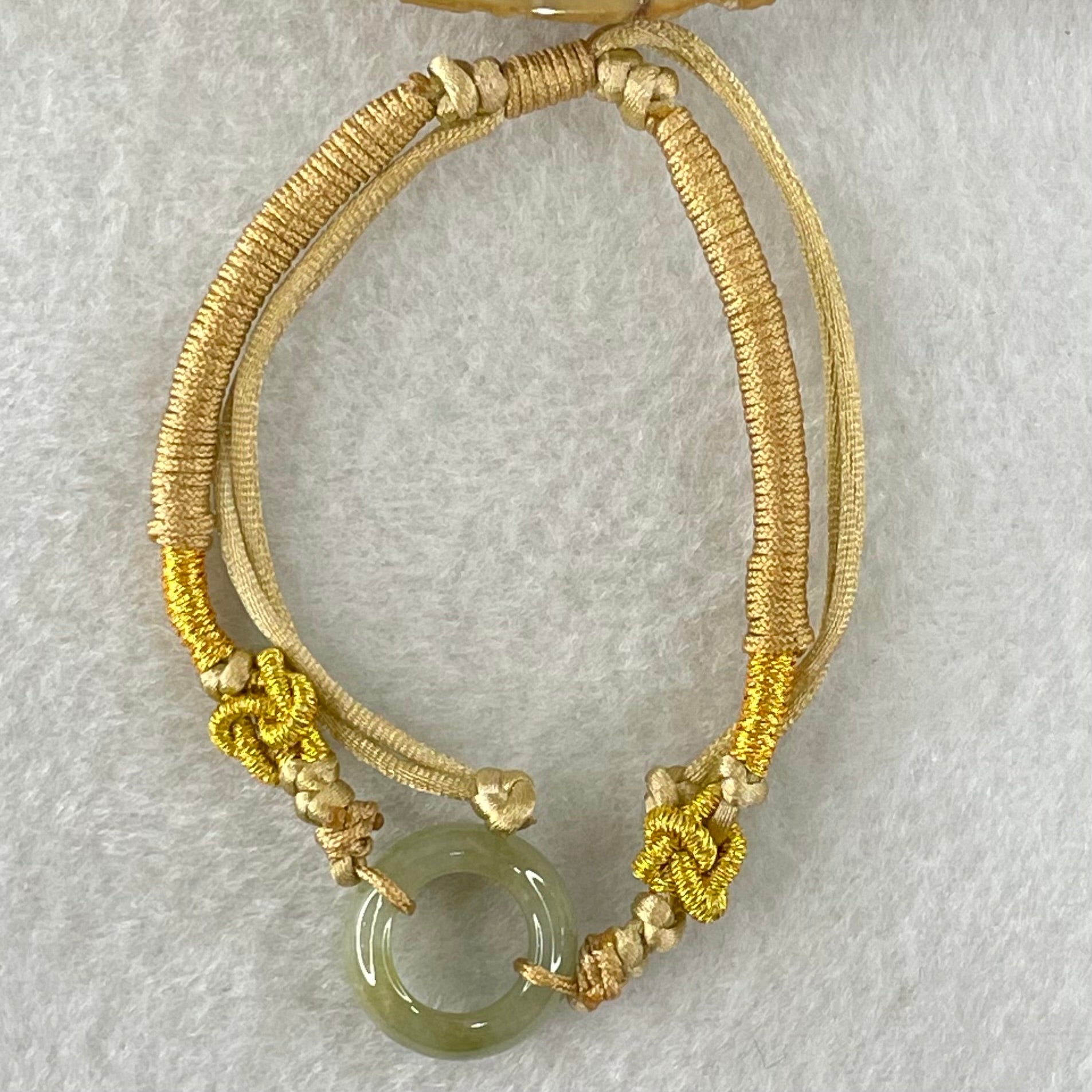 Type A Blueish Green with Brown Jadeite Ping An Kou String Bracelet 2.98g 15.2 by 5.7mm - Huangs Jadeite and Jewelry Pte Ltd