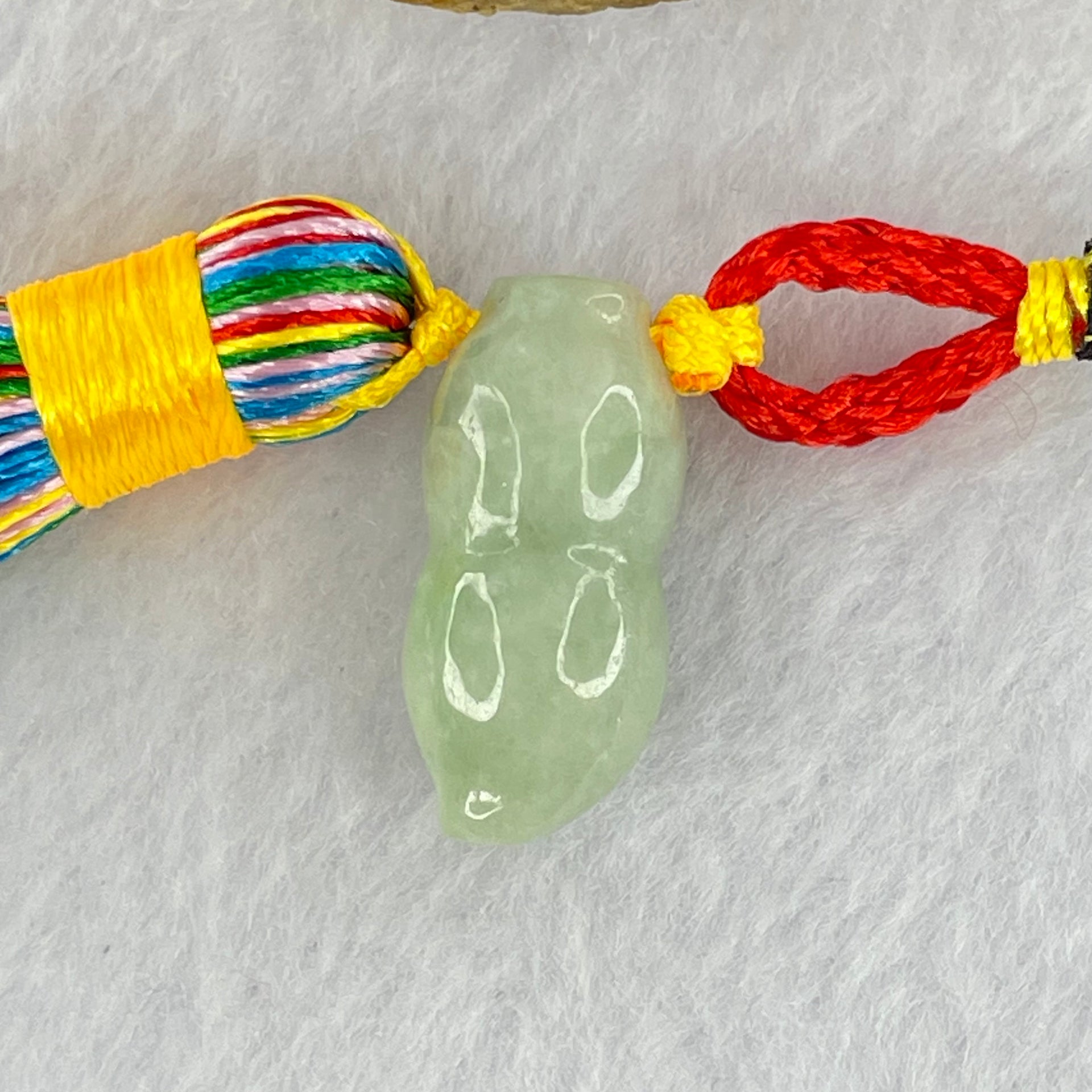 Type A Green Jadeite Peanut Charm Display 10.72g 24.4 by 11.5 by 11.3mm - Huangs Jadeite and Jewelry Pte Ltd