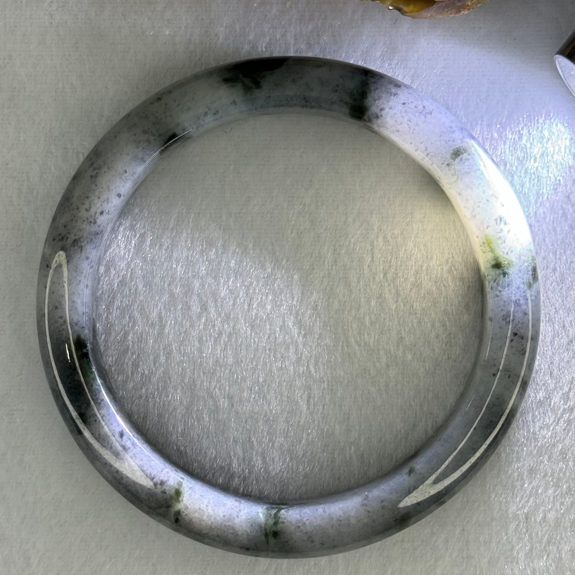 Type A Translucent Faint Grey with Greyish Black Patches Jadeite Bangle Internal Diameter 58.55mm 289.81cts 58.40g 11.8 by 8.6mm With NGI Cert 32885981 (Very Slight Internal Lines) - Huangs Jadeite and Jewelry Pte Ltd
