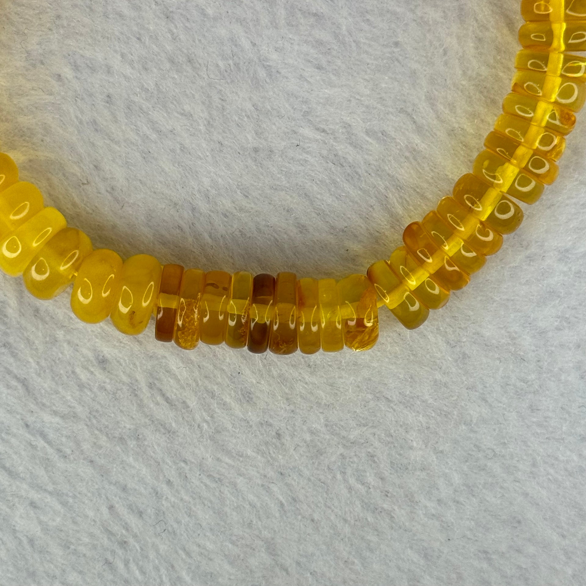 Natural Amber Ping An Kou Donut Shape Bracelet 天然琥珀手链 10.27g 16.5cm 9.2 by 3.3mm 70pcs - Huangs Jadeite and Jewelry Pte Ltd