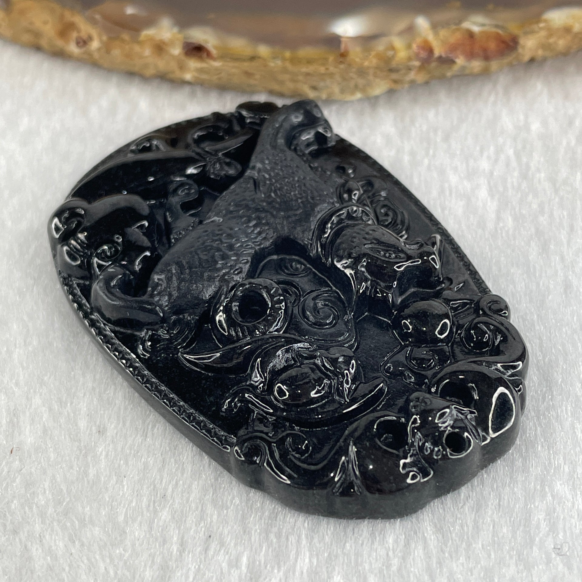 Type A Opaque to Partial Translucent Black Omphacite Jadeite Dog Pendant 23.89g 59.8 by 39.8 by 8.6mm - Huangs Jadeite and Jewelry Pte Ltd