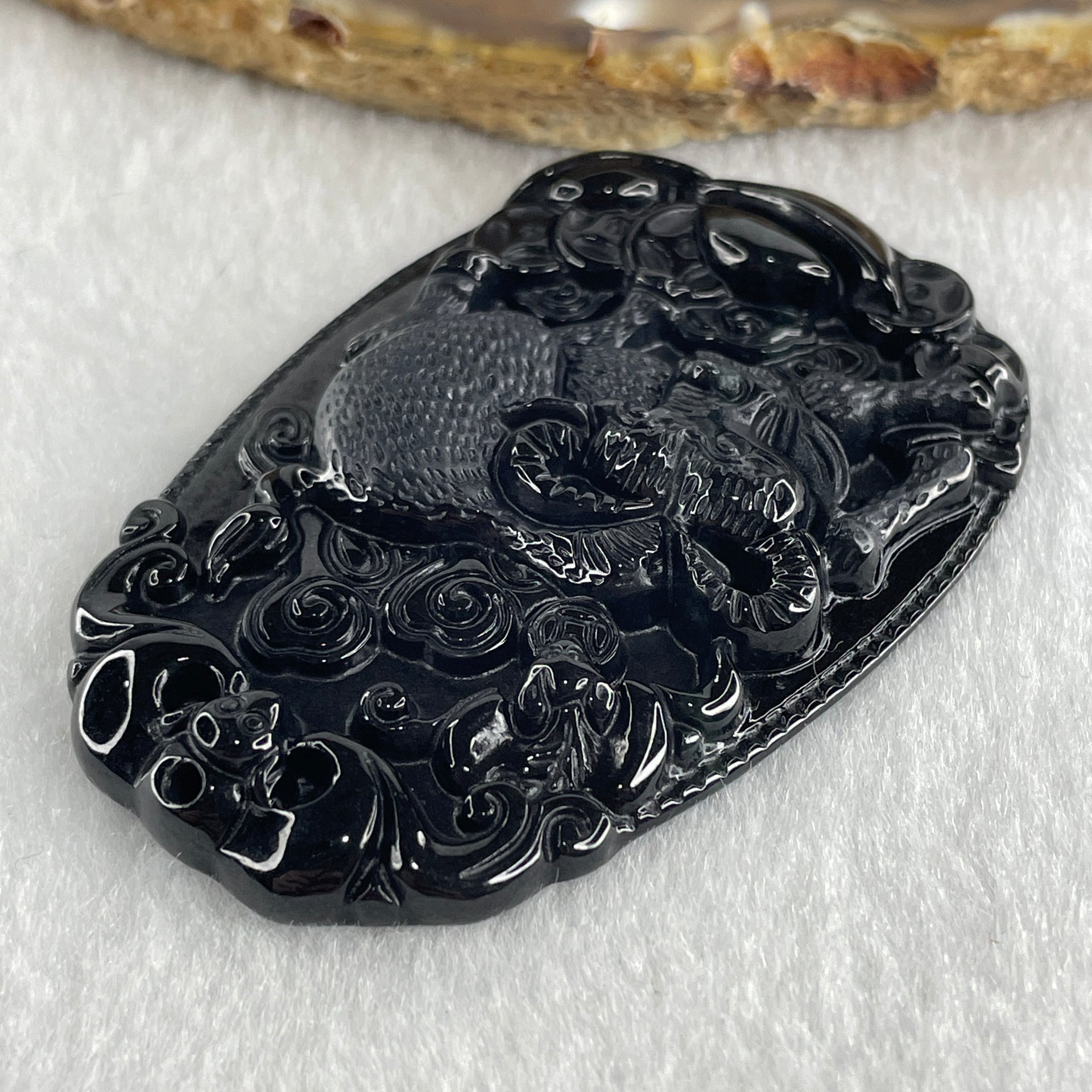 Type A Opaque to Partial Translucent Black Omphacite Jadeite Ox Pendant 20.24g 59.5 by 39.4 by 7.6mm - Huangs Jadeite and Jewelry Pte Ltd