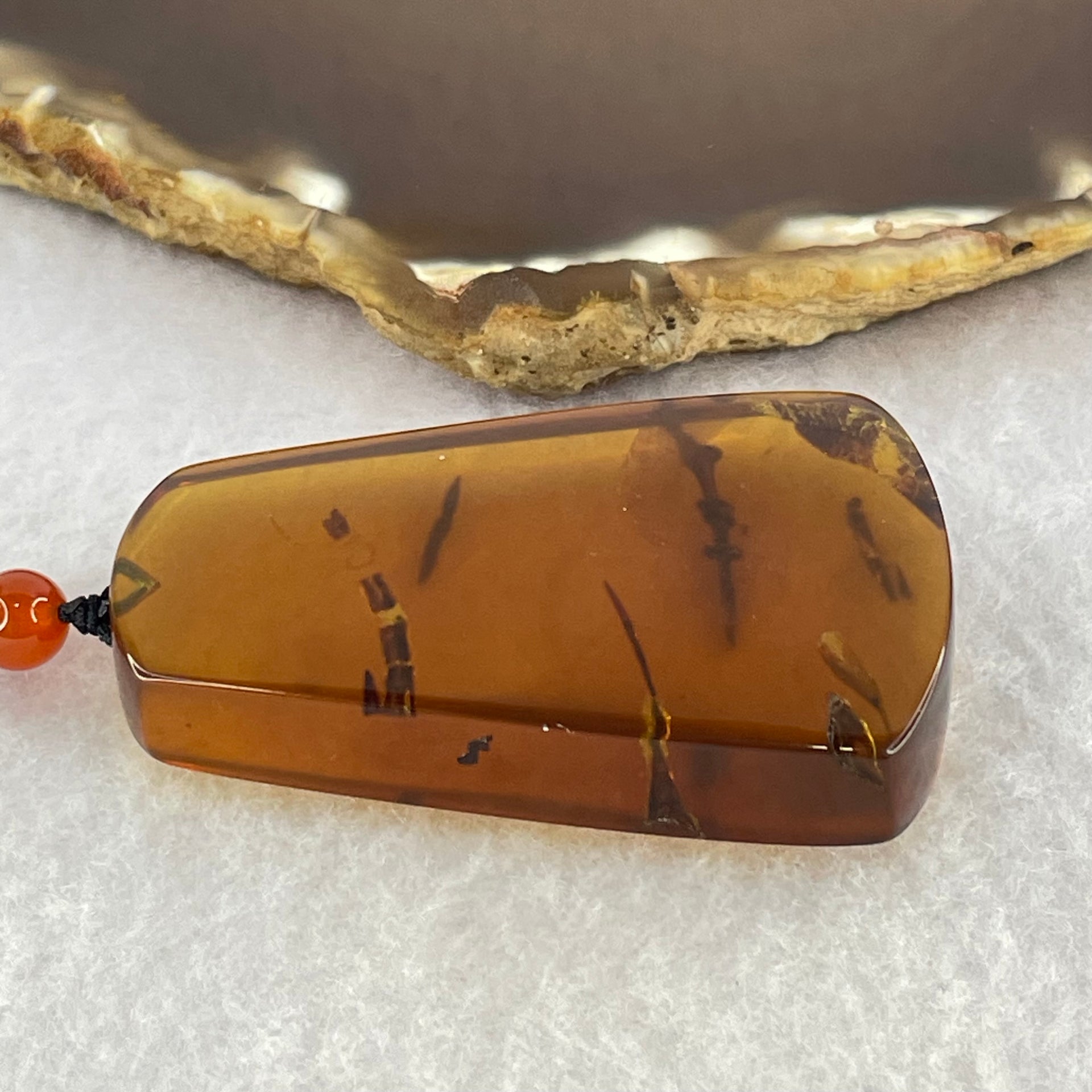 Natural Cognac Flora Amber Pendant 15.12g 52.3 by 34.2 by 12.2mm - Huangs Jadeite and Jewelry Pte Ltd