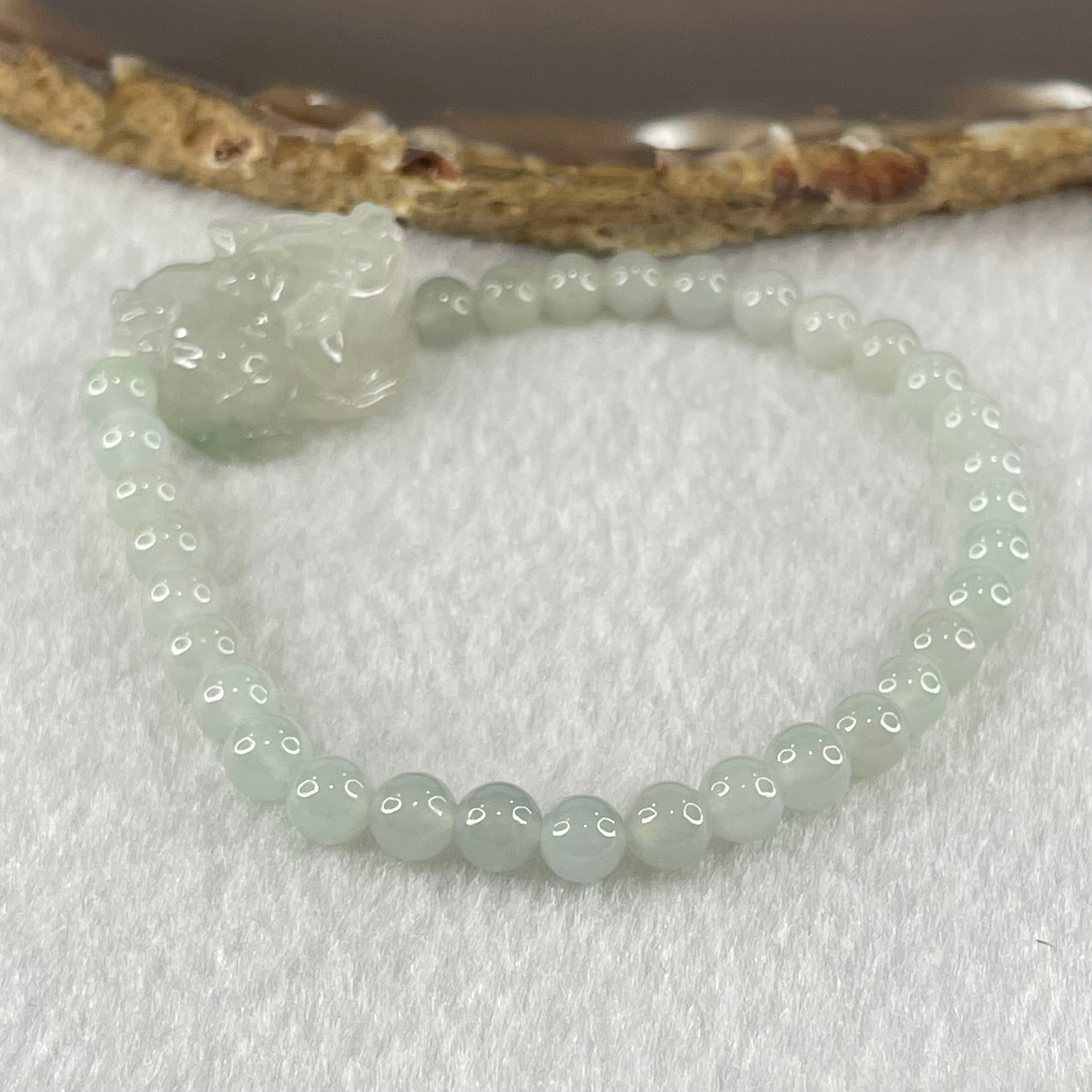 Special Type A Semi Icy Light Blueish Green Jadeite with Male Pixiu Charm Bracelet 5.61g 16cm 5.4mm 32 Beads 22.4 by 11.4 by 11.8mm 1pcs - Huangs Jadeite and Jewelry Pte Ltd