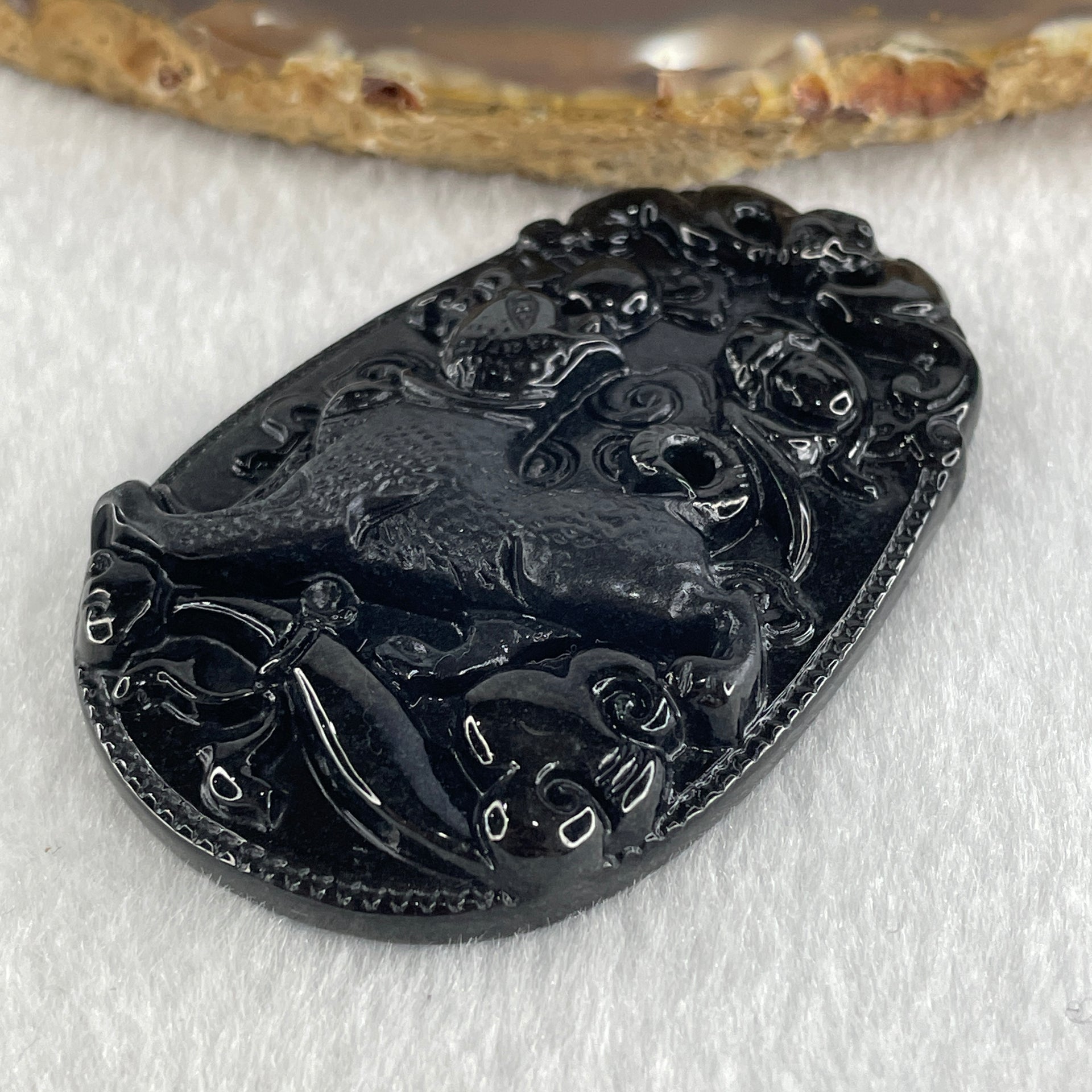 Type A Opaque to Partial Translucent Black Omphacite Jadeite Dog Pendant 23.89g 59.8 by 39.8 by 8.6mm - Huangs Jadeite and Jewelry Pte Ltd