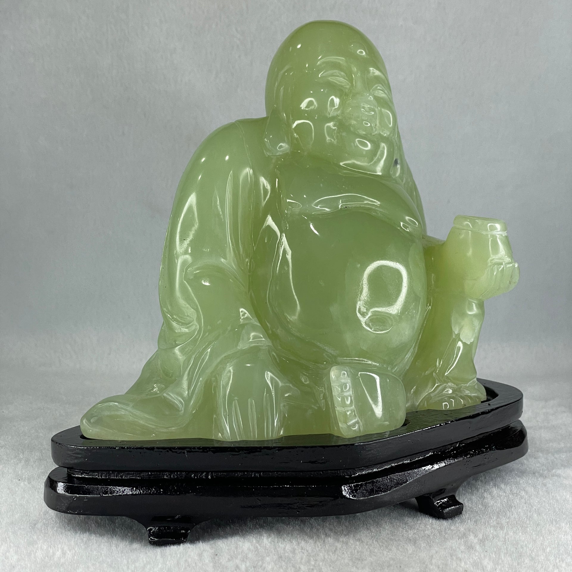 Natural Green Serpentine Siting Milo Buddha with Wealth Pot with Wooden Stand Display 1362.0g 165.0 by 110.0 by 150.0mm - Huangs Jadeite and Jewelry Pte Ltd