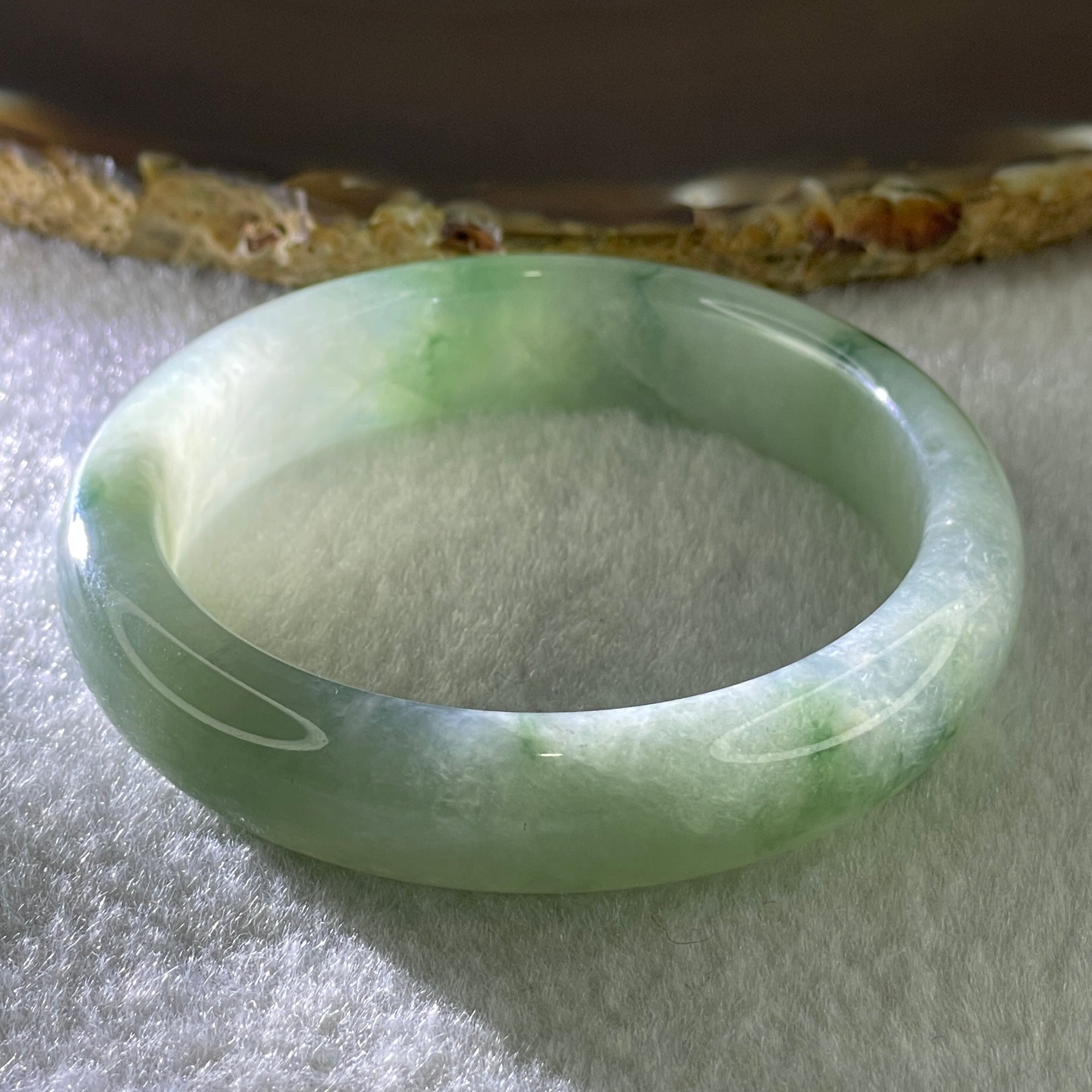 Type A Natural Jelly Light Green with Blueish Green Flora Piao Hua Jadeite Bangle 44.63g Inner Diameter 50.7mm 12.3 by 8.3mm (Internal Lines) - Huangs Jadeite and Jewelry Pte Ltd