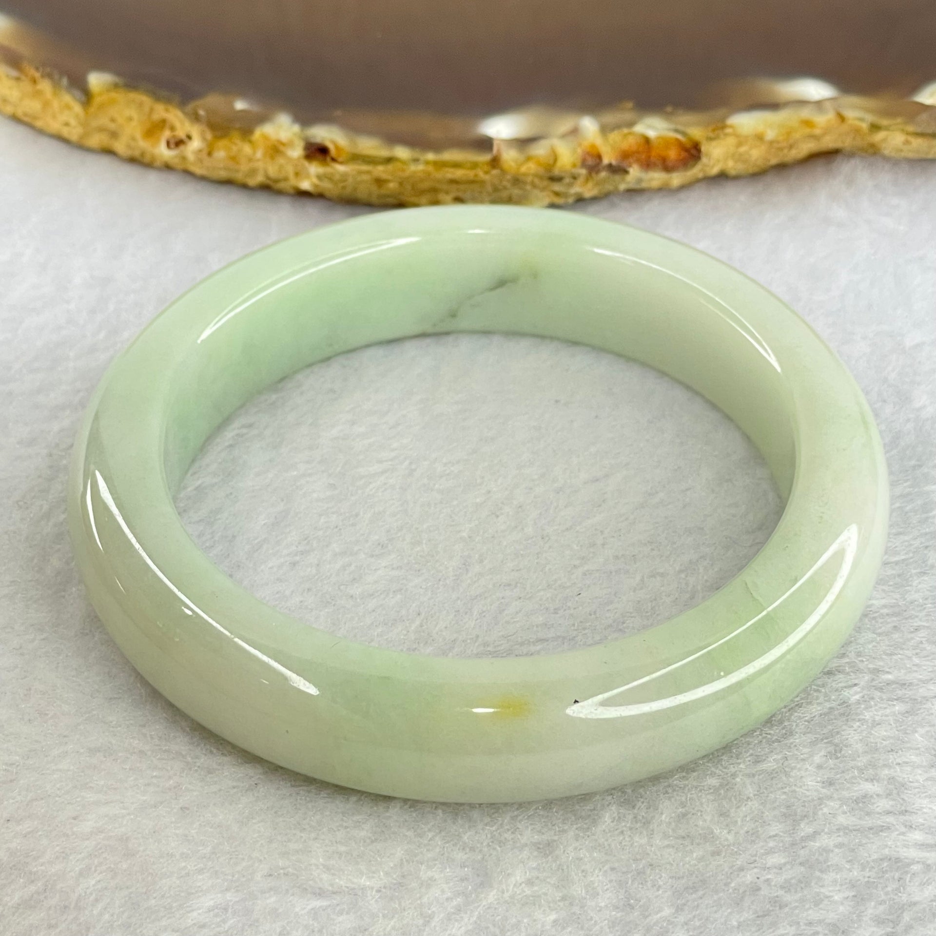 Type A Light Green Jadeite Bangle Internal Diameter 55.5mm 62.19g 12.8 by 8.9mm (External Rough) - Huangs Jadeite and Jewelry Pte Ltd