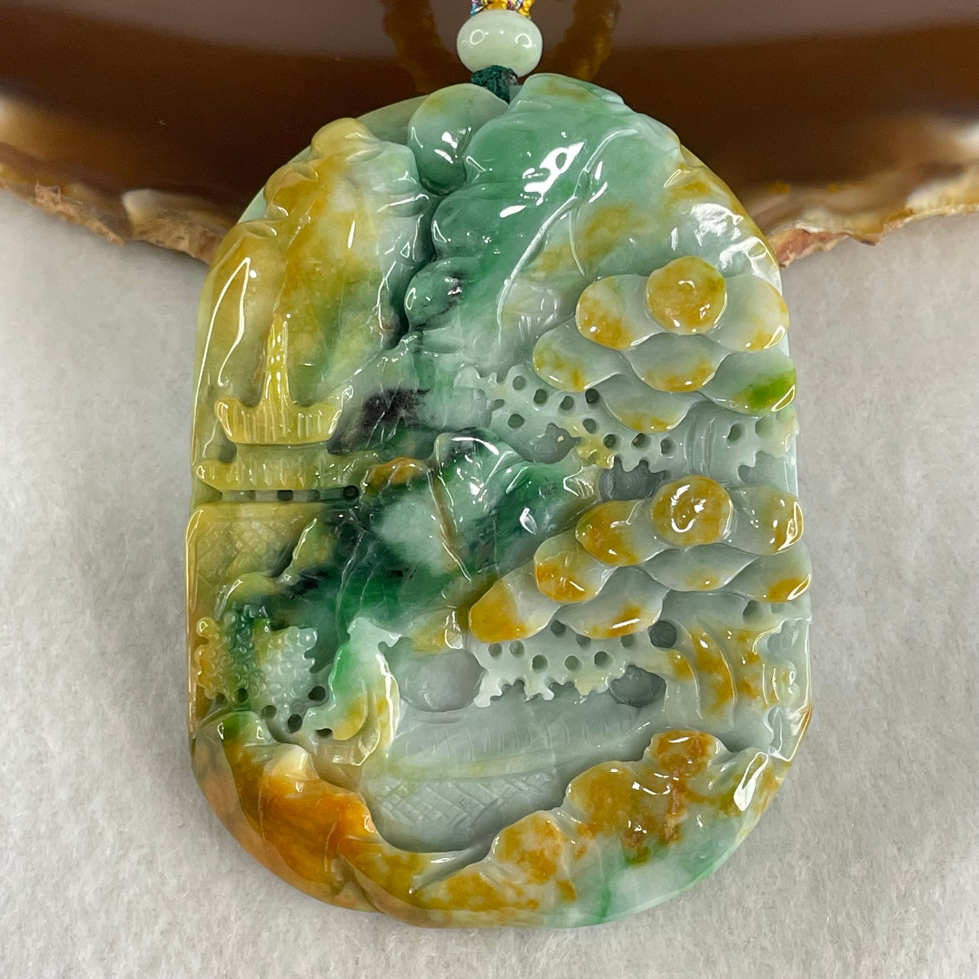 Type A Brown Blueish Green with Yellow Jadeite Shan Shui with Guiren Benefactor Pendant 93.95g 66.8 by 49.0 by 13.8mm - Huangs Jadeite and Jewelry Pte Ltd