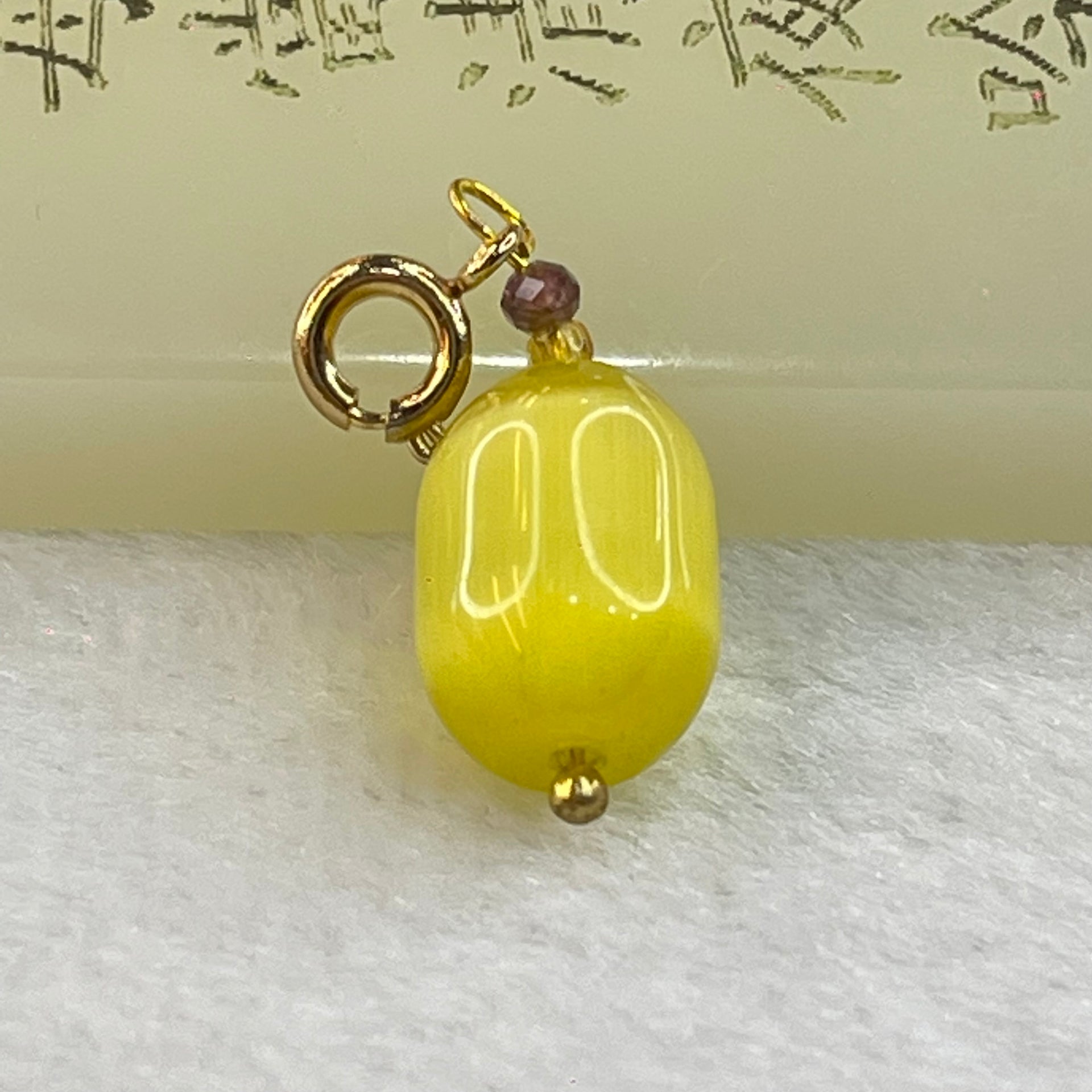 Yellow Cat's Eye Glass Charm Pendent 2.43g 14.4 by 10.0mm - Huangs Jadeite and Jewelry Pte Ltd