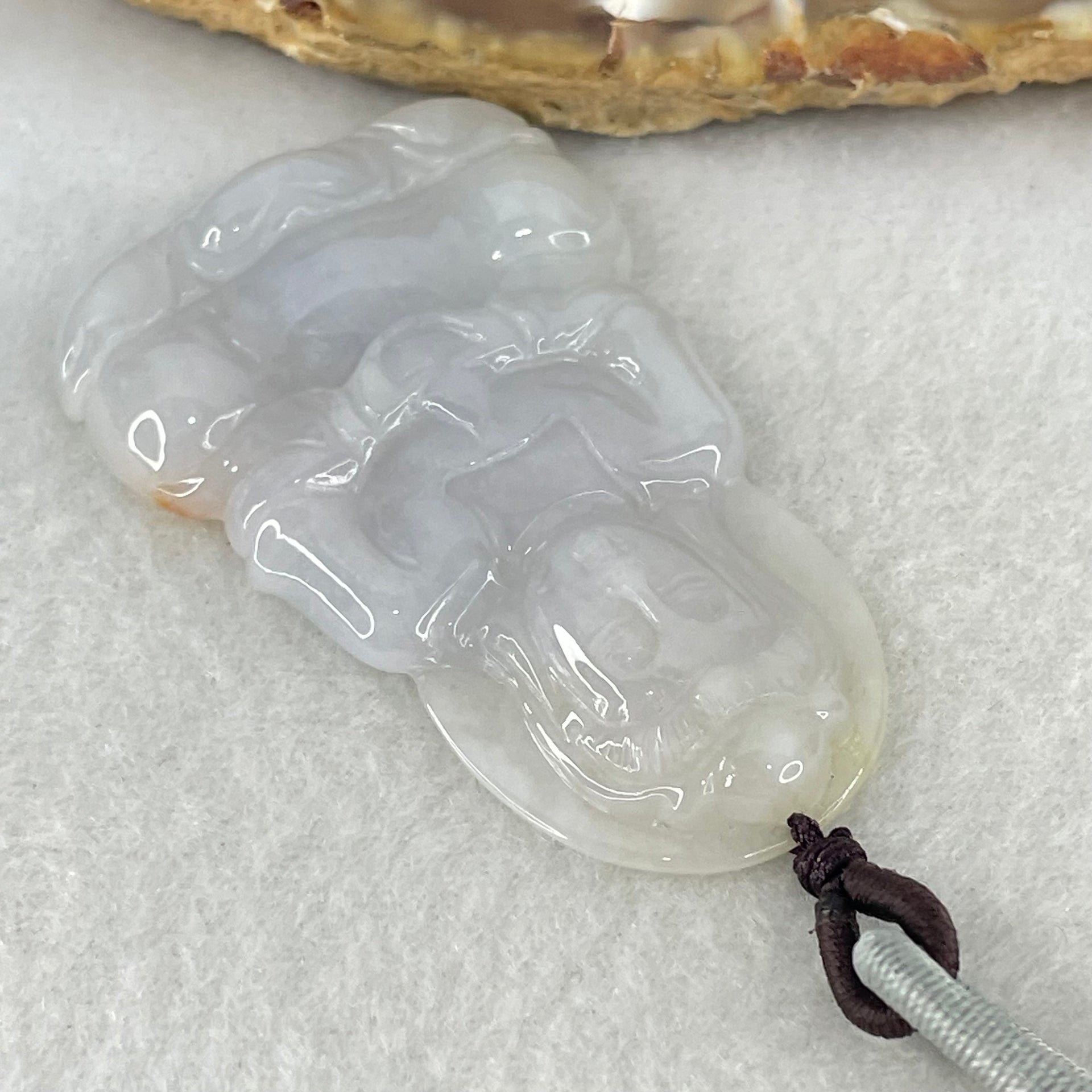Type A Lavender Jadeite Guan Yin Pendant 16.26g 52.2 by 33.1 by 6.0mm - Huangs Jadeite and Jewelry Pte Ltd