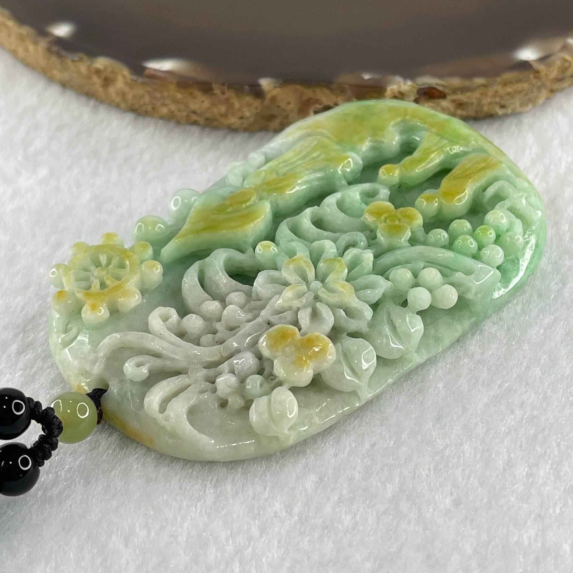 Natural Type A Blueish Green with Yellow Jadeite Buddha and Flowers with People Seeking for Enlightenment Pendant 87.75g 72.8 by 45.7 by 11.8mm - Huangs Jadeite and Jewelry Pte Ltd