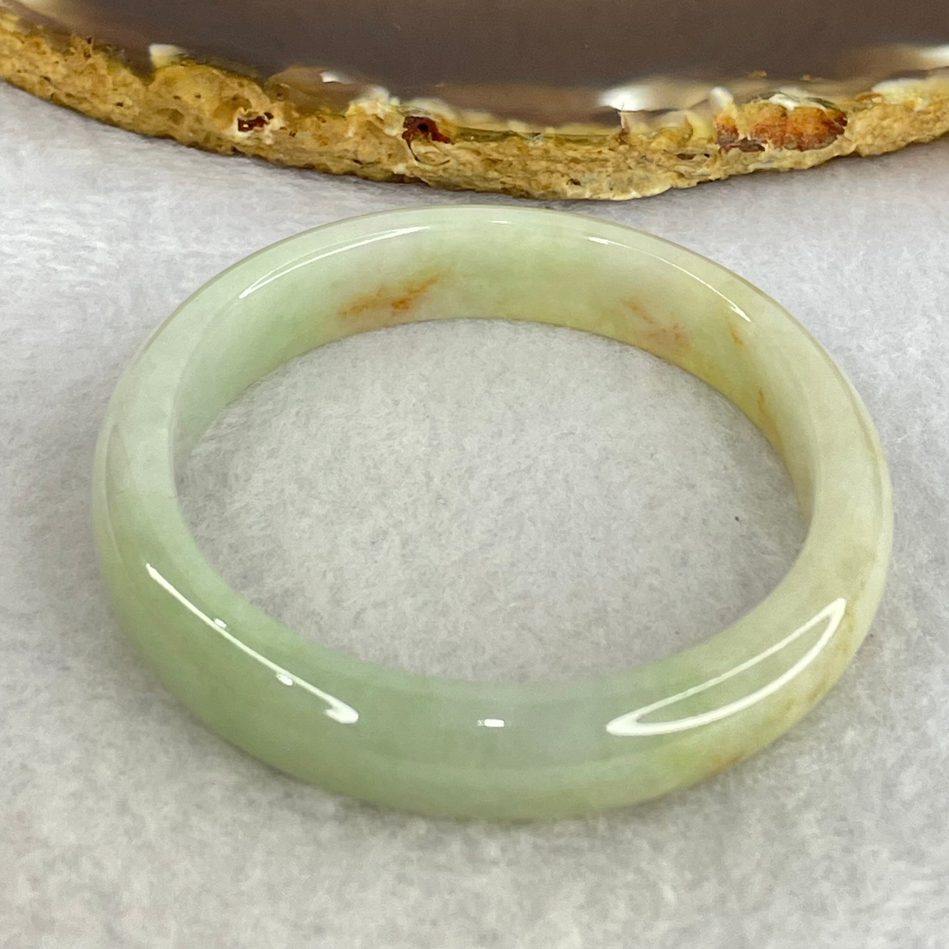 Type A Light Blueish Green and Red and Brown Patches Jadeite Oval Bangle Internal Diameter 54.3mm 32.17g 10.4 by 6.5mm (Very Slight Internal Lines) - Huangs Jadeite and Jewelry Pte Ltd