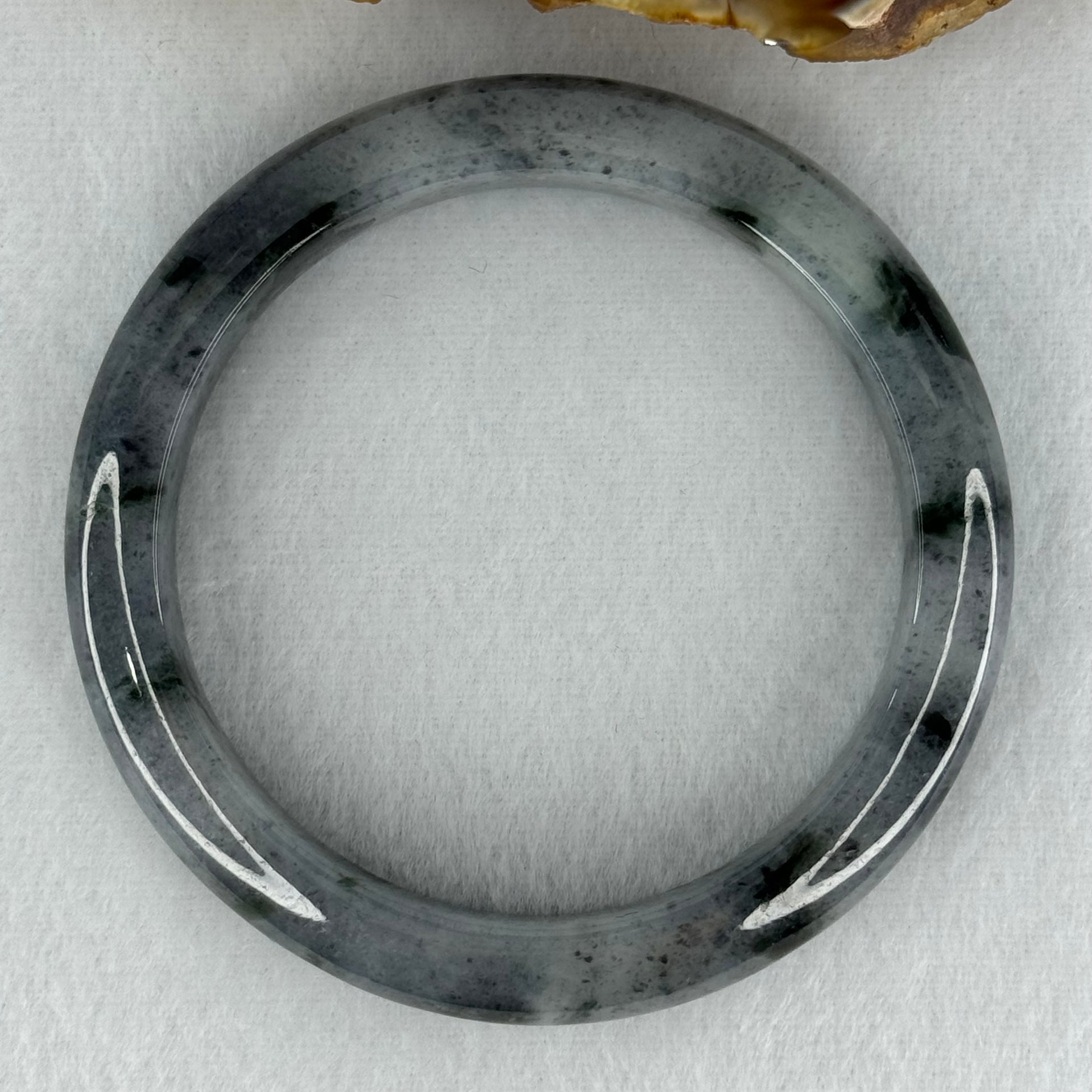 Type A Translucent Faint Grey with Greyish Black Patches Jadeite Bangle Internal Diameter 58.55mm 289.81cts 58.40g 11.8 by 8.6mm With NGI Cert 32885981 (Very Slight Internal Lines) - Huangs Jadeite and Jewelry Pte Ltd