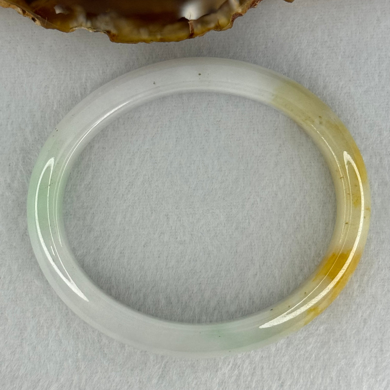 Type A Faint Lavender Green with Yellow Patches Jadeite Oval Bangle Internal Diameter 56.5mm  37.8696g 11.1 by 7.3mm (Very Slight Internal Line) - Huangs Jadeite and Jewelry Pte Ltd