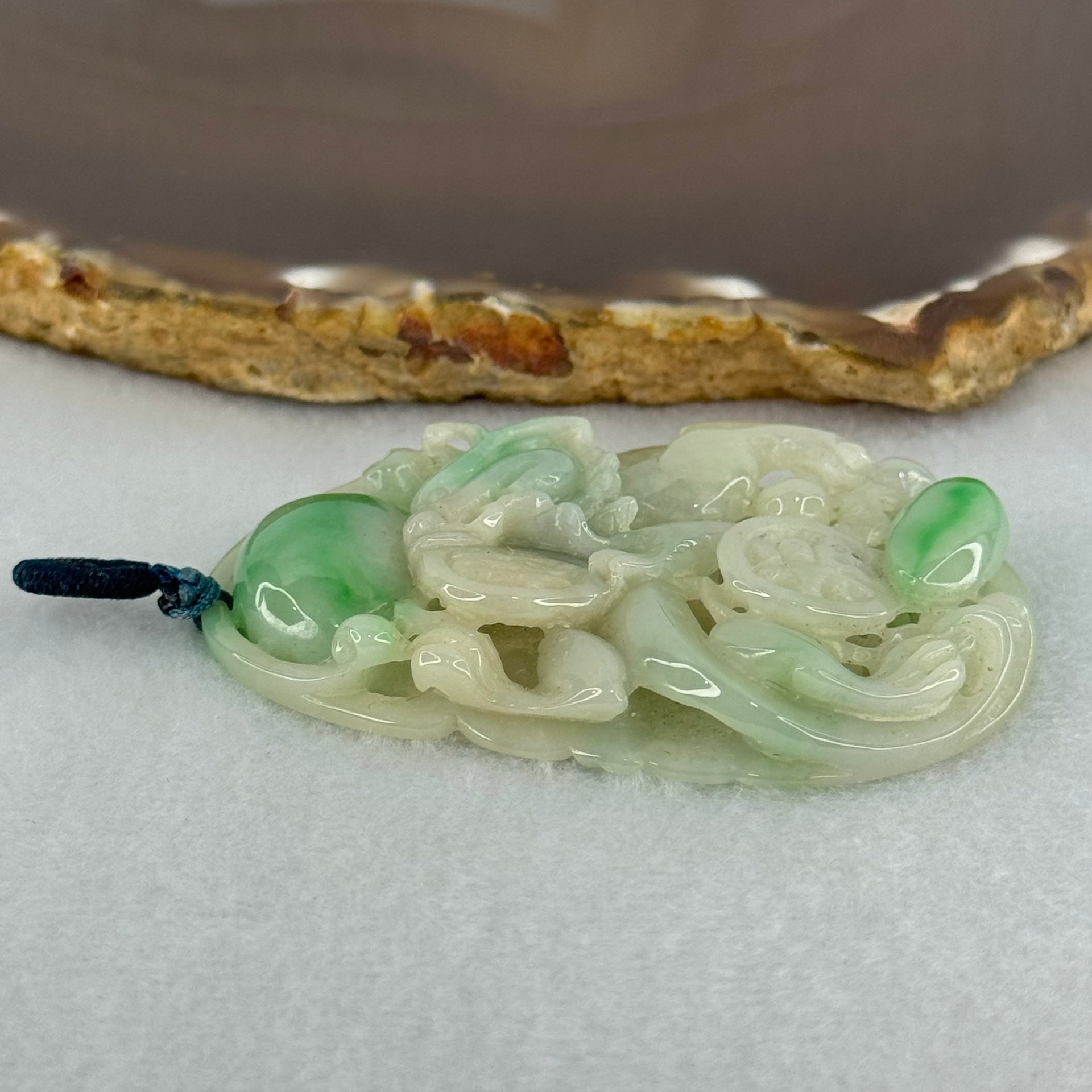 Type A Natural Light Green with Apple Green Jadeite 3D Dragon In Hollow Carving Pendant 27.58g 58.65 by 39.42 by 8.48mm with NGI Cert No. 16824716 - Huangs Jadeite and Jewelry Pte Ltd