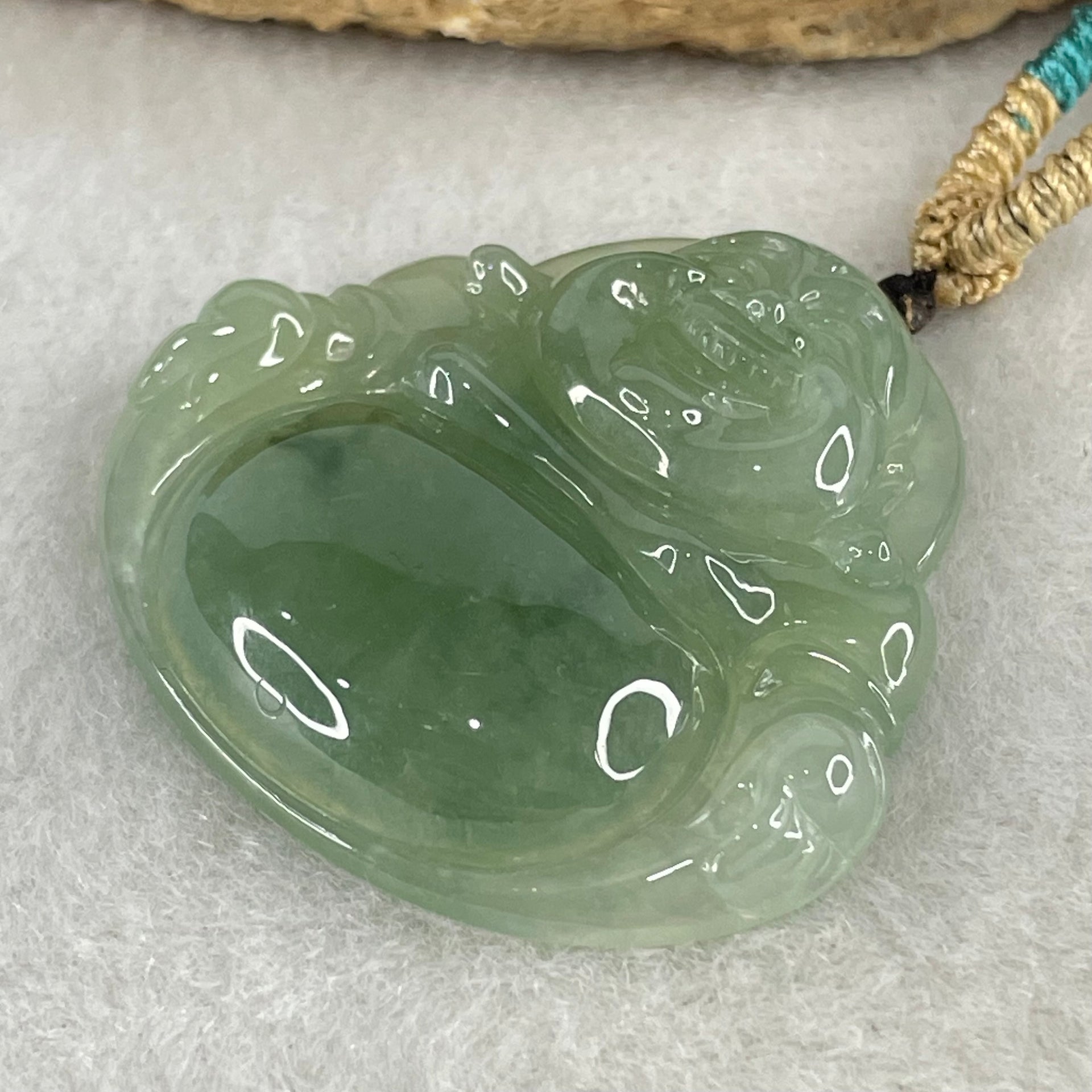 Type A Icy Green with Blueish Green Piao Hua Floral Jadeite Milo Buddha Pendant 13.81g 33.8 by 36.3 by 6.5mm - Huangs Jadeite and Jewelry Pte Ltd