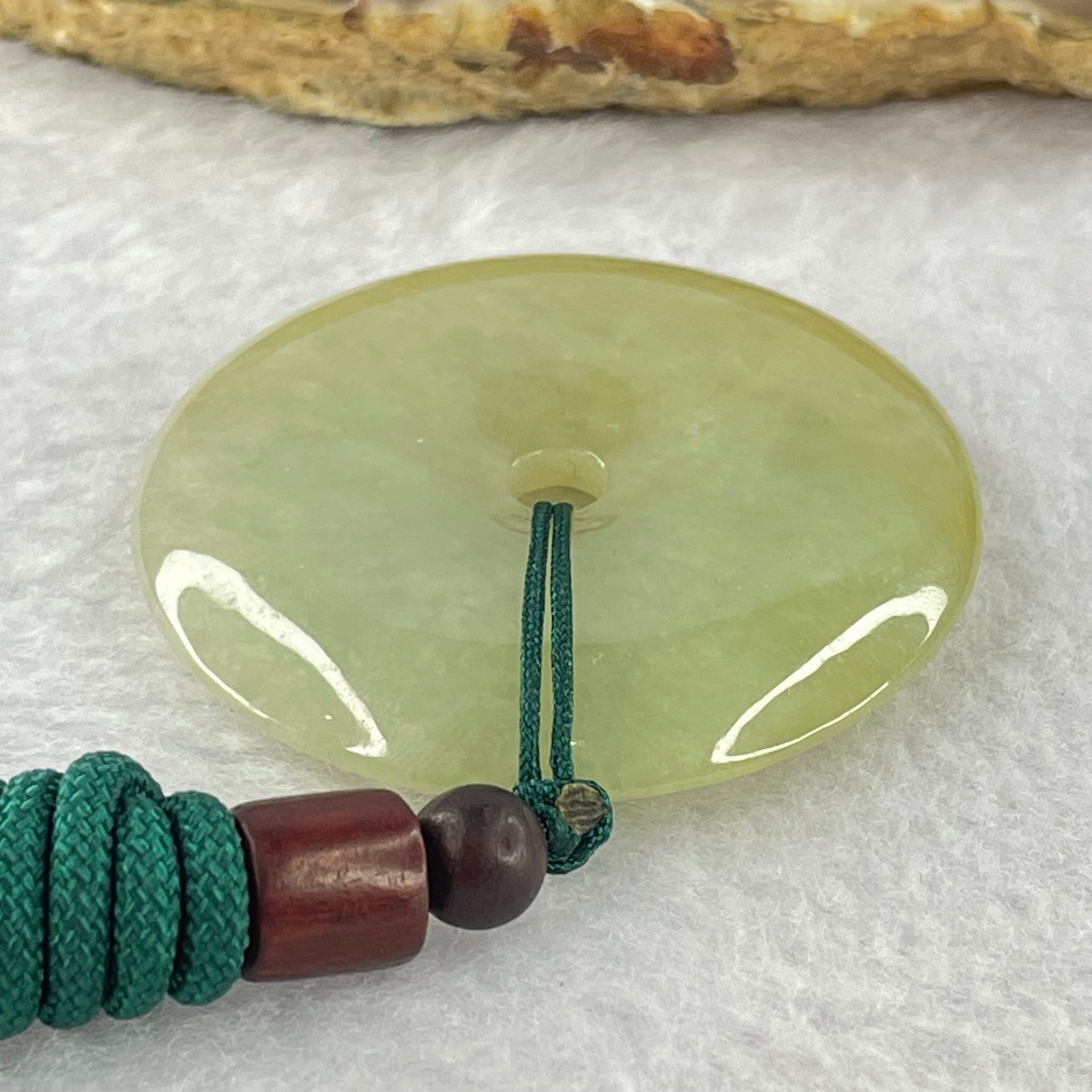 Type A Yellowish Green Jadeite Ping An Kou Donut Pendent 24.41g 43.0 by 7.1mm - Huangs Jadeite and Jewelry Pte Ltd