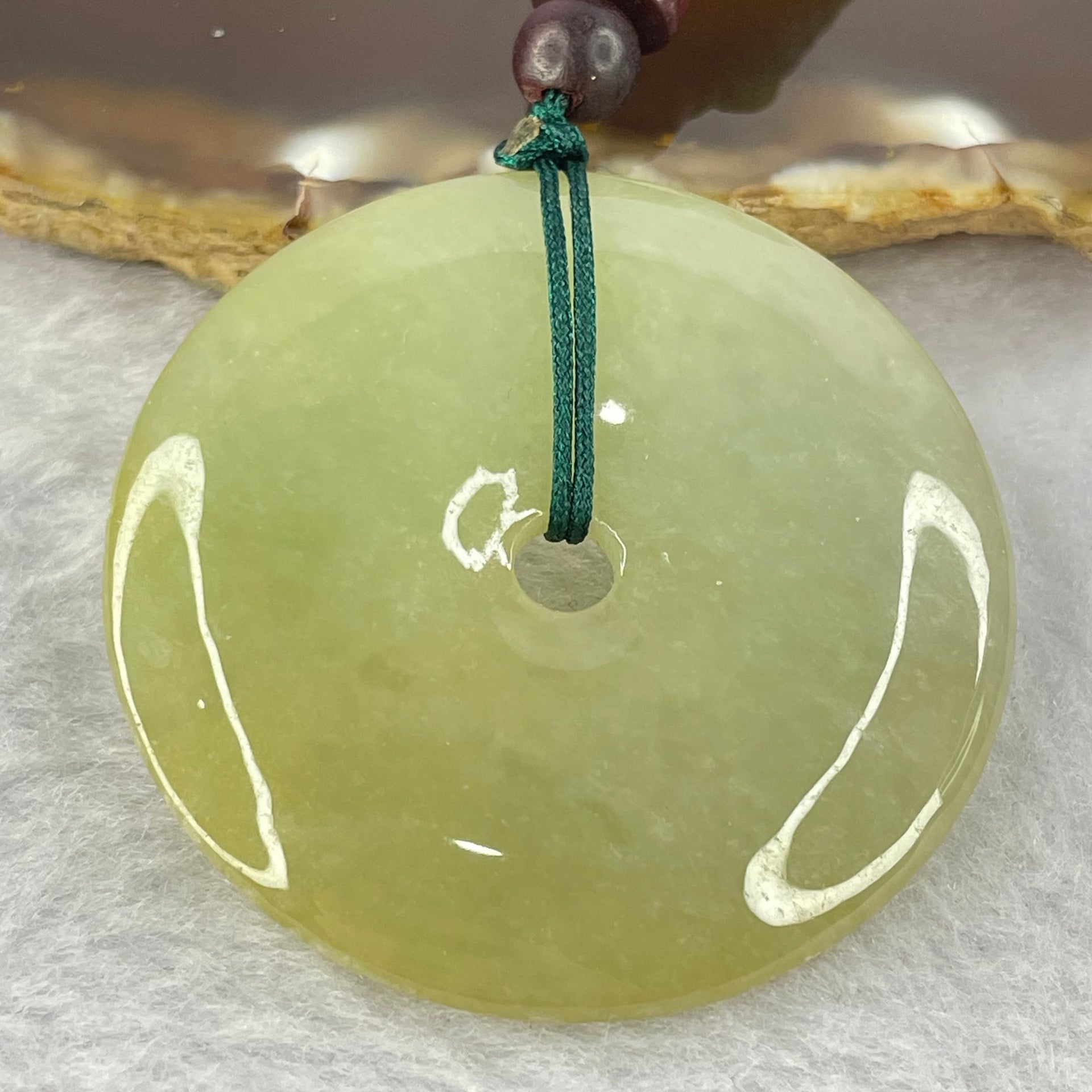 Type A Yellowish Green Jadeite Ping An Kou Donut Pendent 24.41g 43.0 by 7.1mm - Huangs Jadeite and Jewelry Pte Ltd