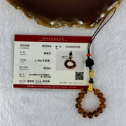 Natural Cognac Amber with Damo Head Handphone Strap 4.30g 7.6mm 13 Beads - Huangs Jadeite and Jewelry Pte Ltd