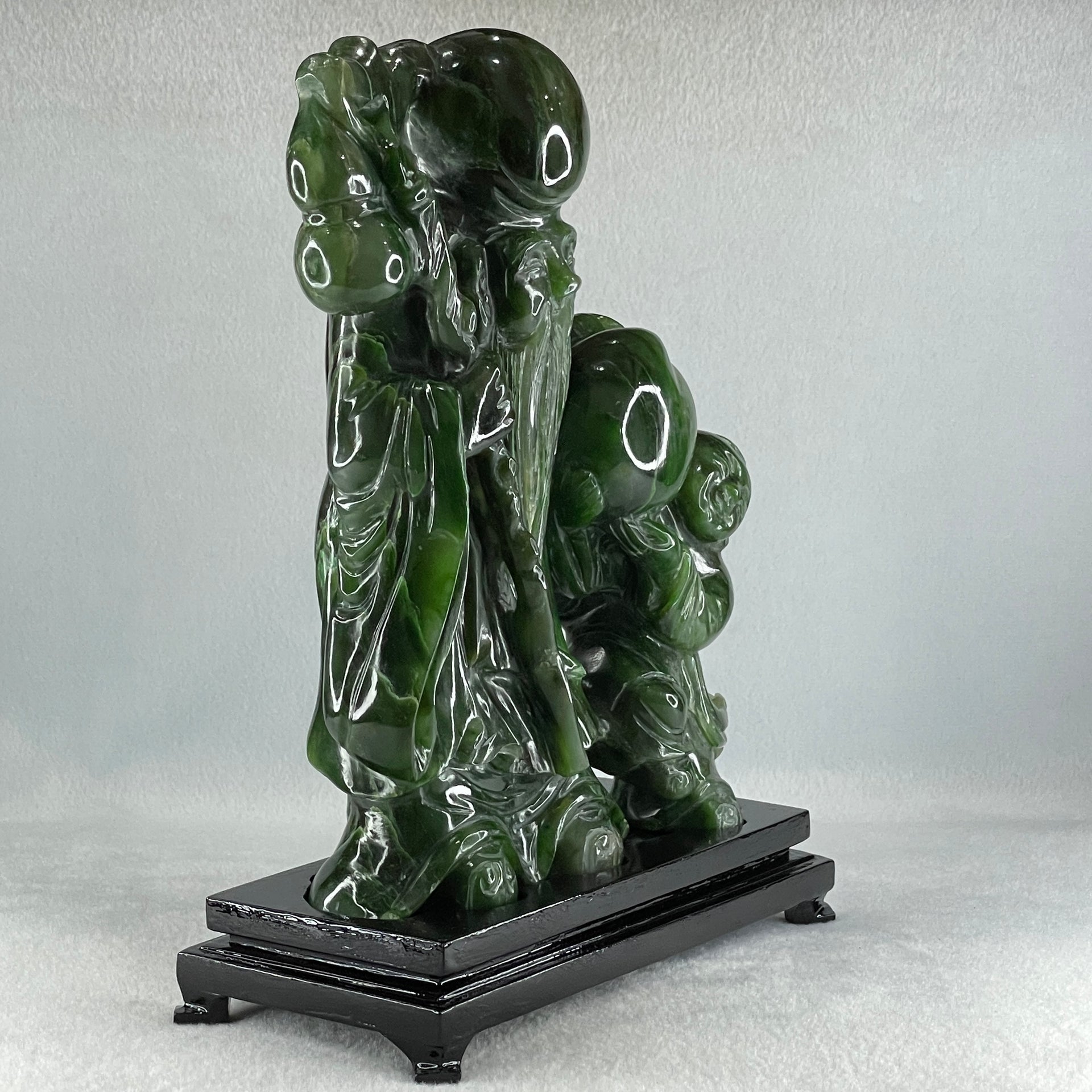 Natural Dark Green Serpentine Shou Xing Gong and Tong Zi and Longevity Peach with Wooden Stand Display 3,091.3g 193.0 by 95.0 by 257.0mm - Huangs Jadeite and Jewelry Pte Ltd