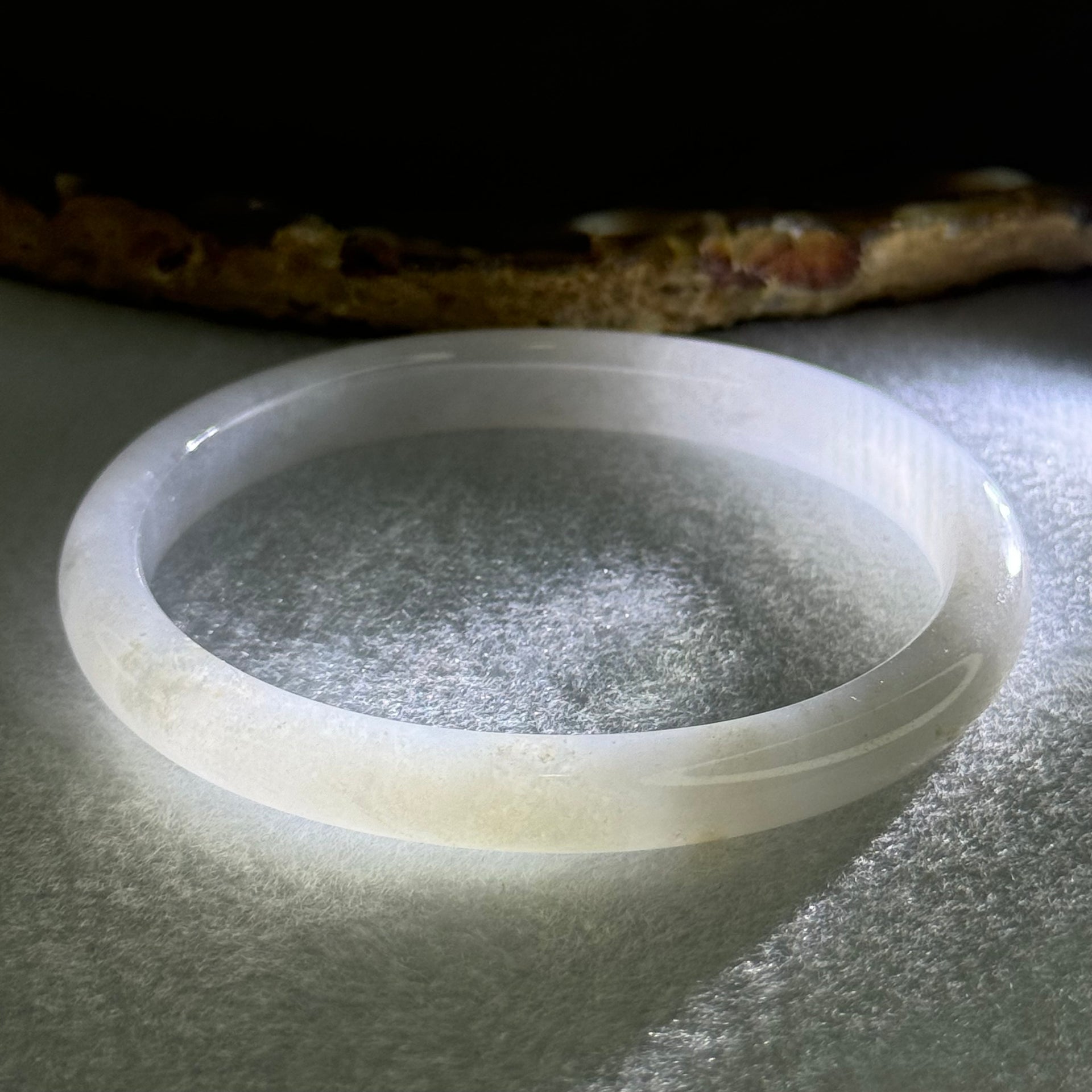 Type A Semi Icy Faint Lavender Green with Reddish Spot Jadeite Oval Bangle Internal Diameter 54.4mm 21.33g 7.5 by 6.0mm (very slight internal line) - Huangs Jadeite and Jewelry Pte Ltd
