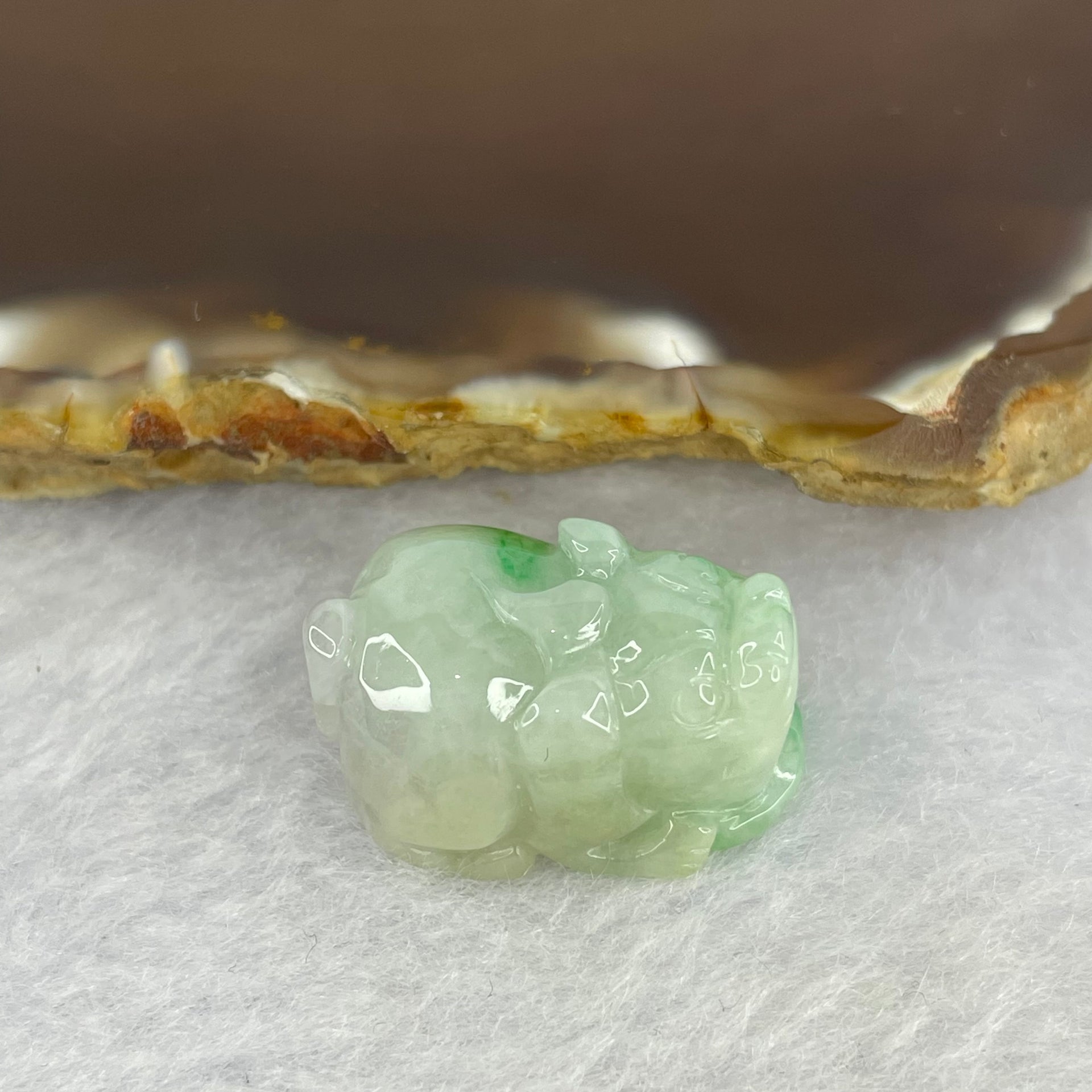 Type A Bright Green with Faint Lavender Jadeite Pixiu Pendent A货辣绿和浅紫罗兰翡翠貔貅吊坠 8.32g 22.8 by 16.2 by 12.0 mm - Huangs Jadeite and Jewelry Pte Ltd