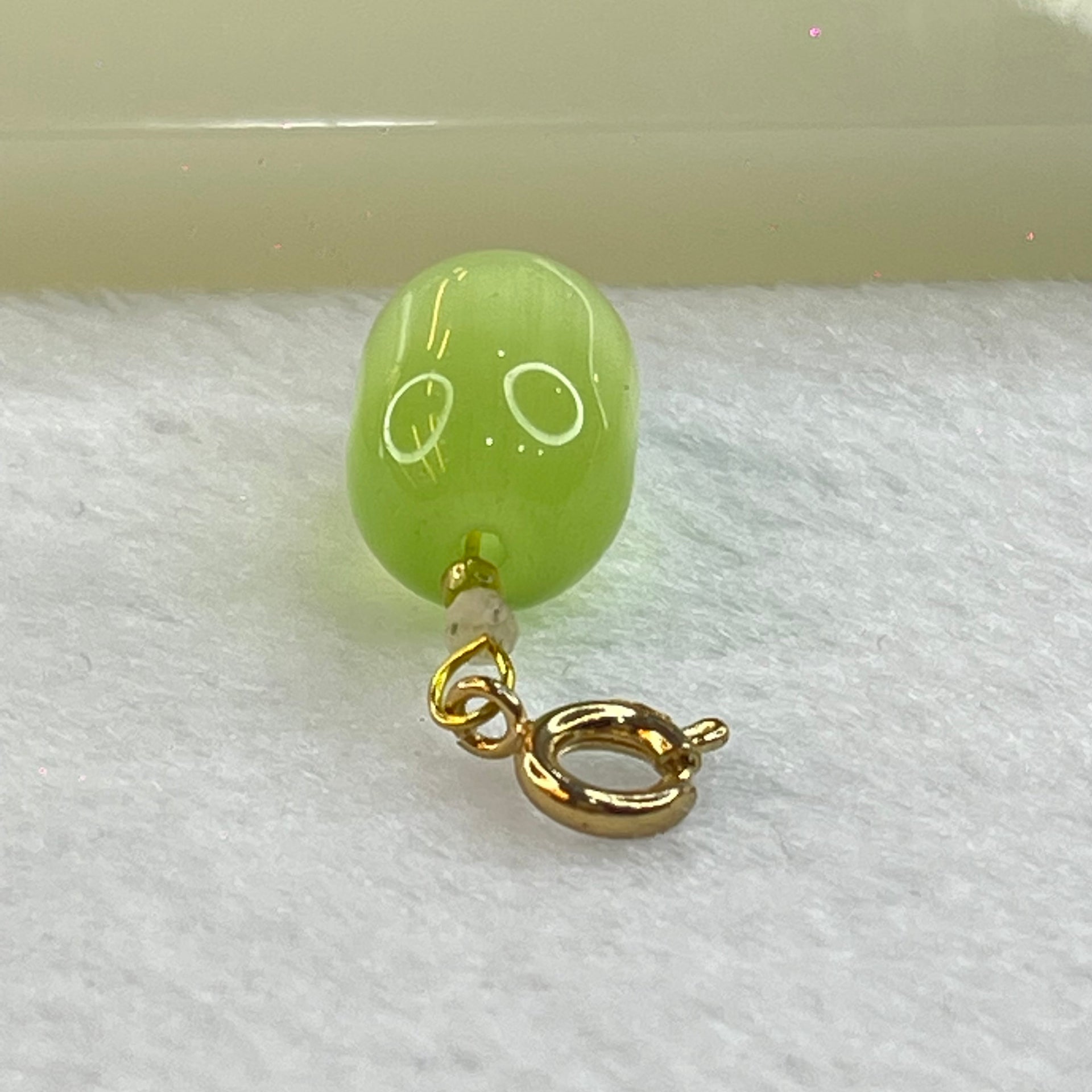 Green Cat's Eye Glass Charm Pendent 2.48g 14.3m by 9.8mm - Huangs Jadeite and Jewelry Pte Ltd