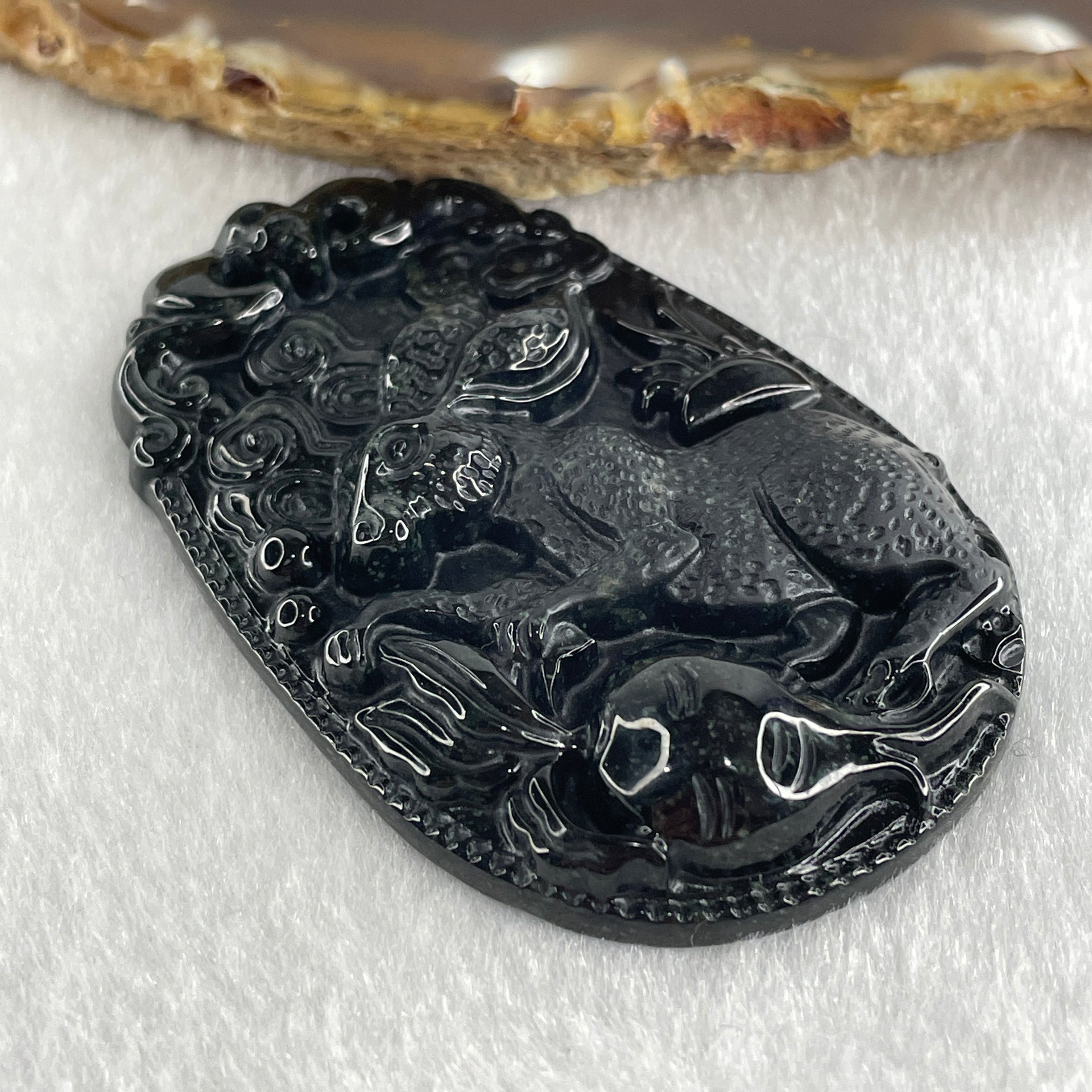 Type A Opaque to Partial Translucent Black Omphacite Jadeite Rabbit Pendant 25.89g 60.2 by 39.8 by 8.9mm - Huangs Jadeite and Jewelry Pte Ltd