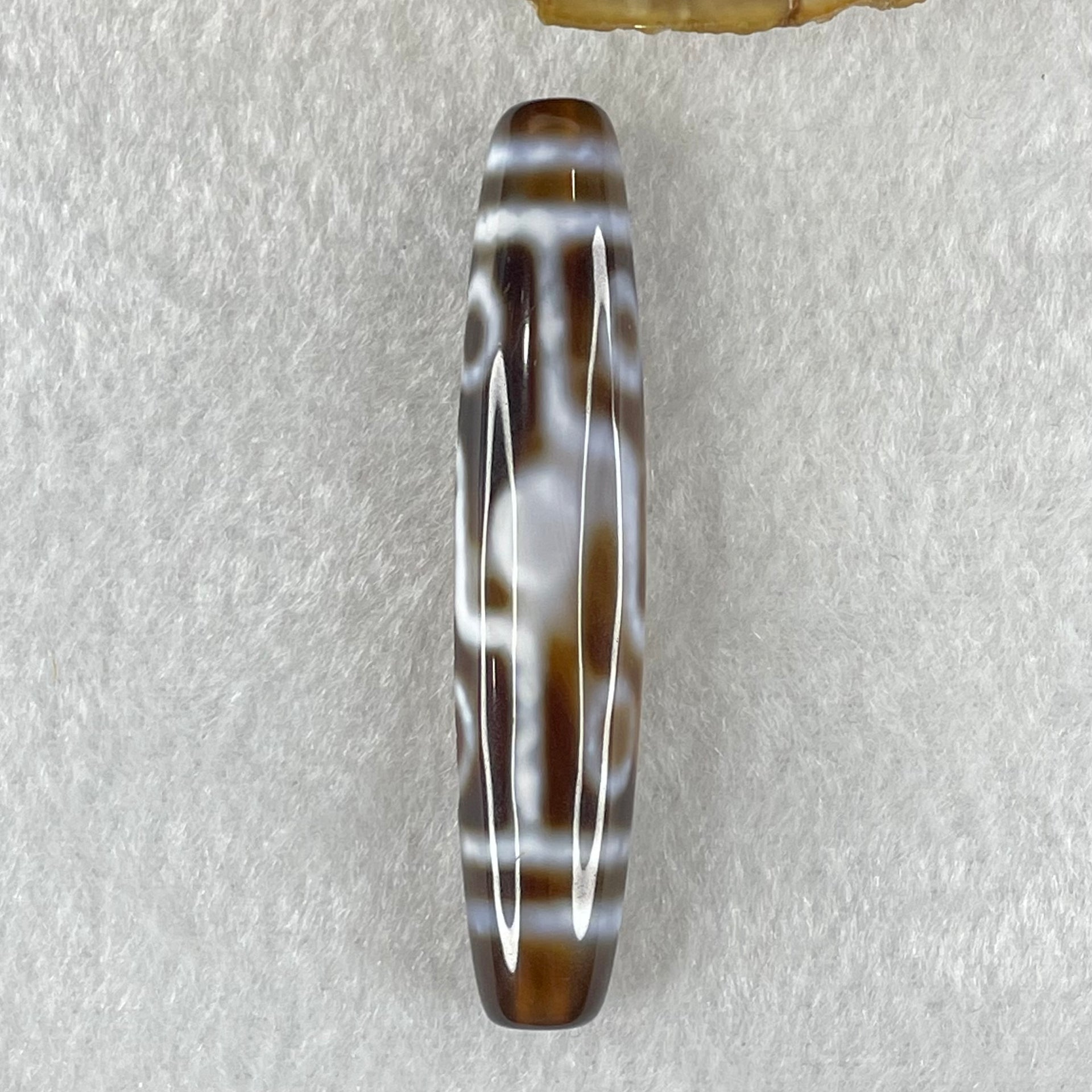 Natural Powerful Tibetan Old Oily Agate Zha Ji La Mu Female Cai Shen Carvings on 9 Eyes Dzi Bead Heavenly Master (Tian Zhu) 九眼扎基拉姆女财神天珠 11.04g 57.9 by 12.0mm - Huangs Jadeite and Jewelry Pte Ltd