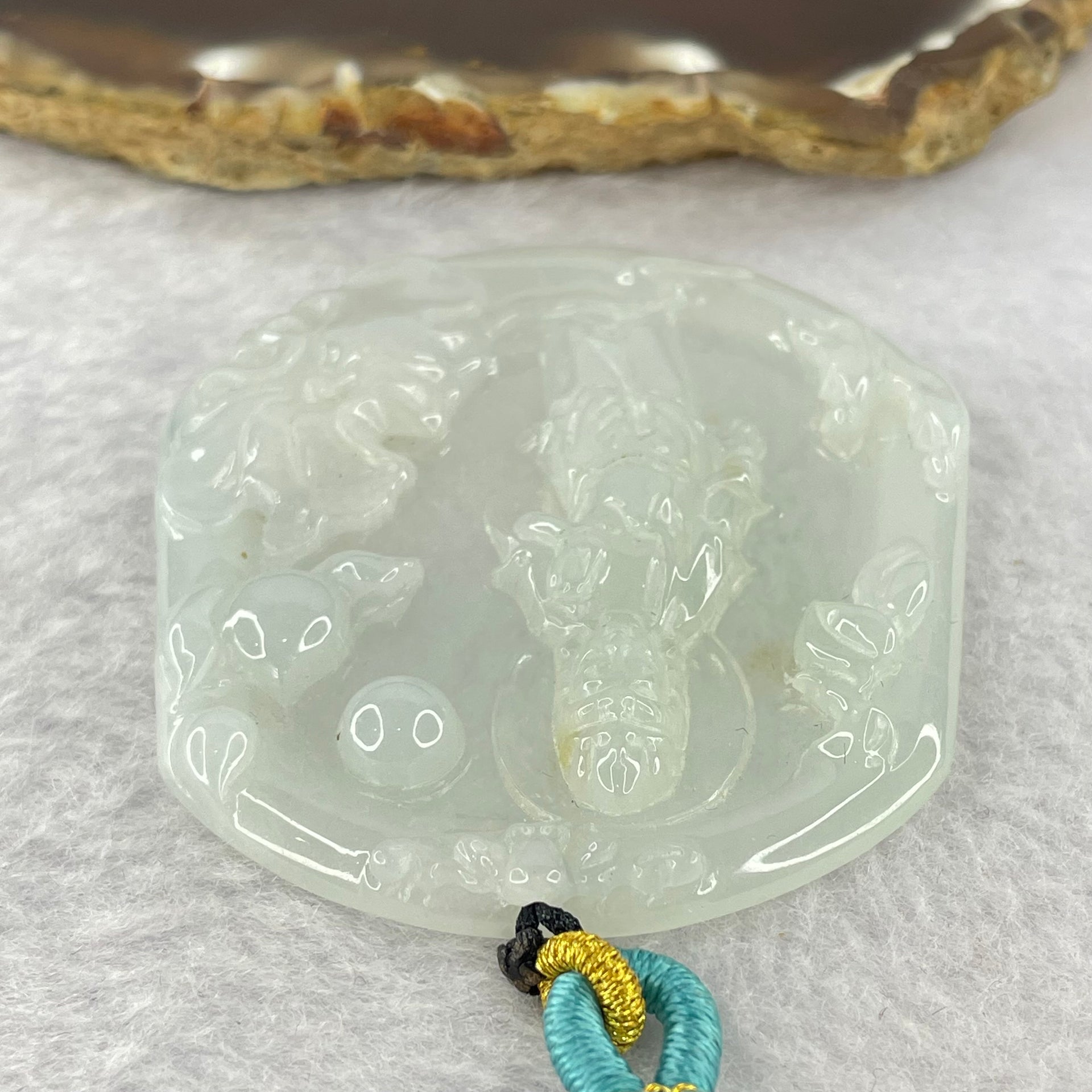 Type A Light Green to white Jadeite Guan Yin Pendent 32.29g 57.8 by 52.6 by 6.6mm - Huangs Jadeite and Jewelry Pte Ltd