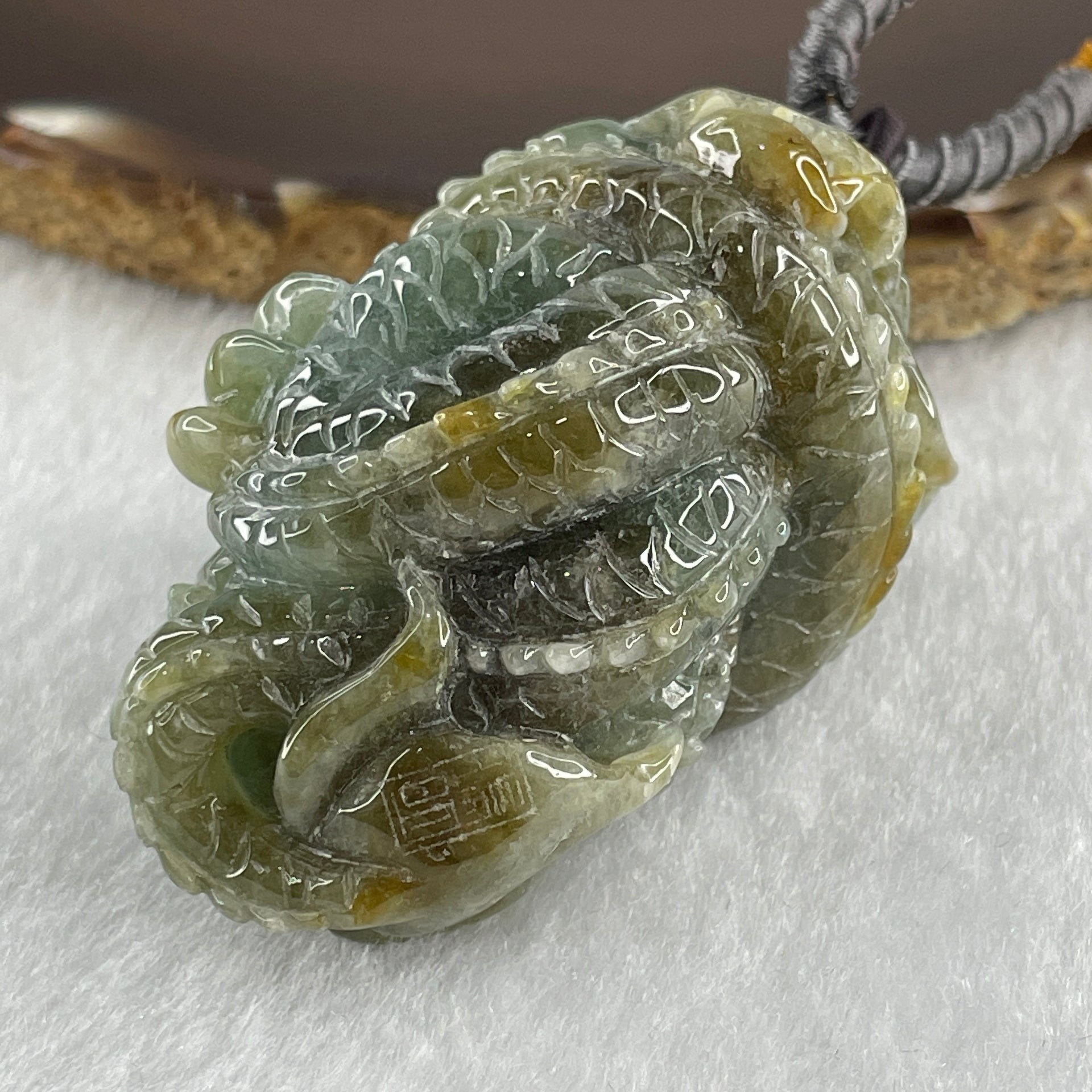 Type A Green with Yellow Patches Jadeite Dragon Pendant 97.19g 57.7 by 34.2 by 34.4mm - Huangs Jadeite and Jewelry Pte Ltd