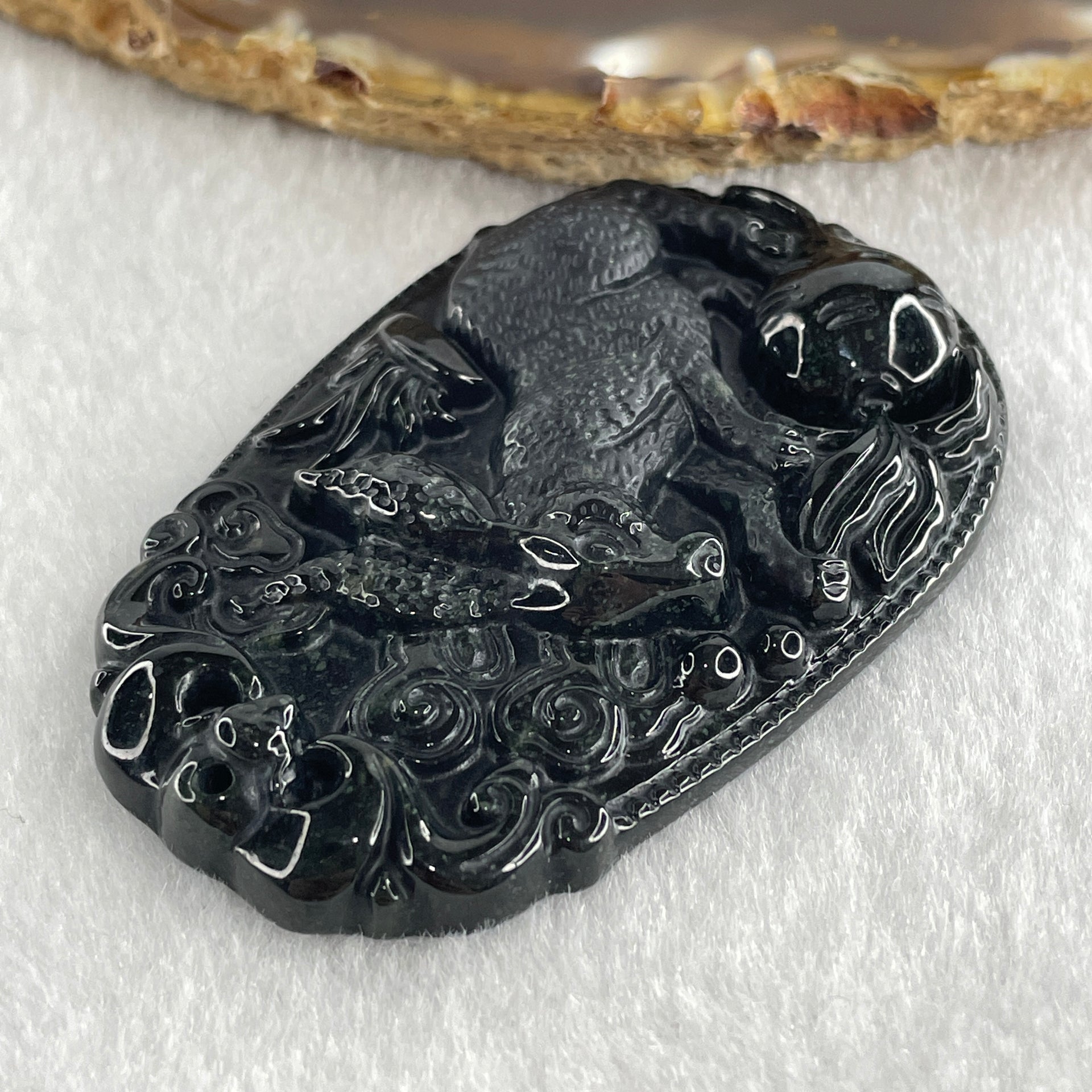 Type A Opaque to Partial Translucent Black Omphacite Jadeite Rabbit Pendant 25.89g 60.2 by 39.8 by 8.9mm - Huangs Jadeite and Jewelry Pte Ltd