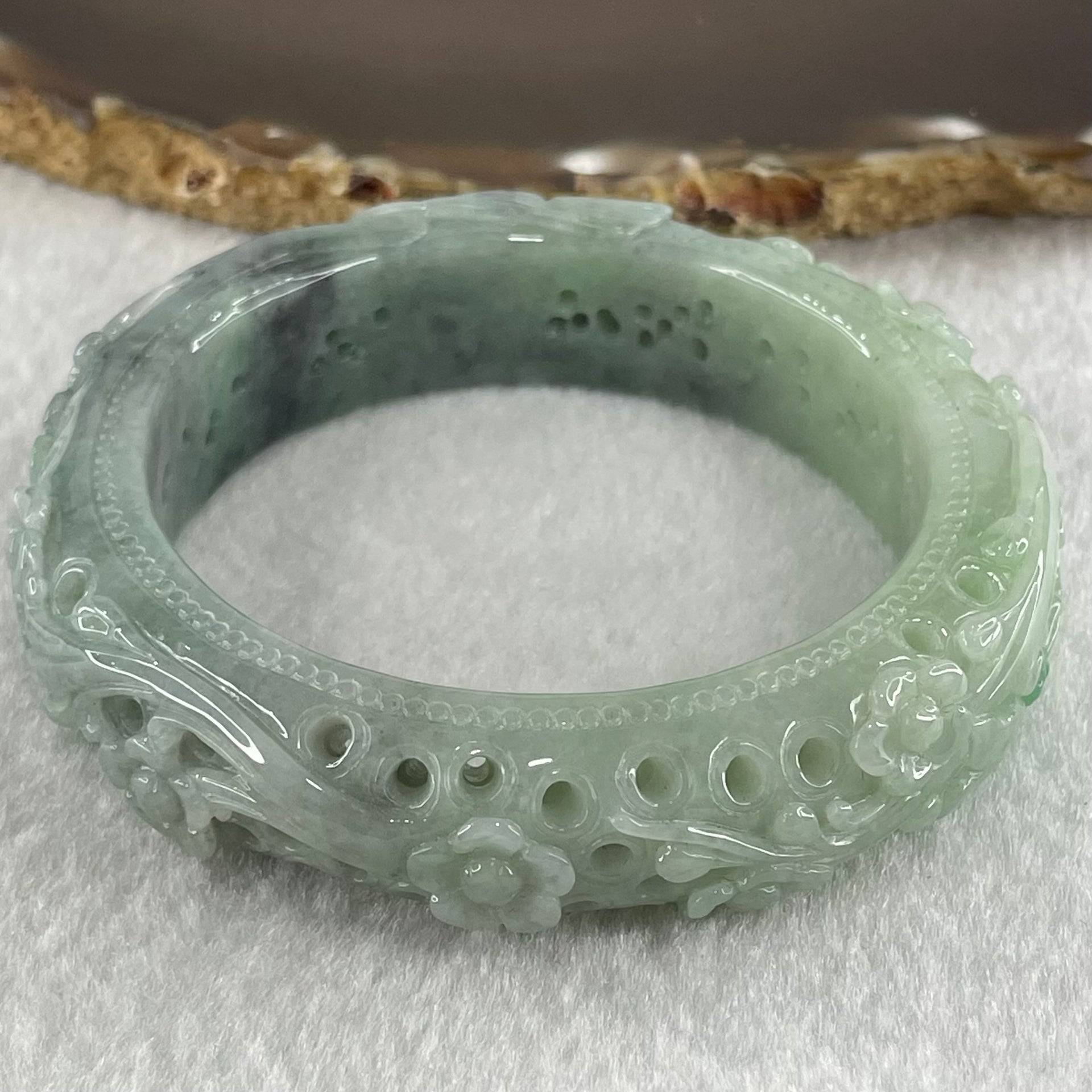 Type A Light to Dark Blueish Green Jadeite Carved with Prosperity Flowers Twin Birds and Butterfly Bangle 78.70g Internal Diameter 55.0mm 15.7 by 11.0mm - Huangs Jadeite and Jewelry Pte Ltd