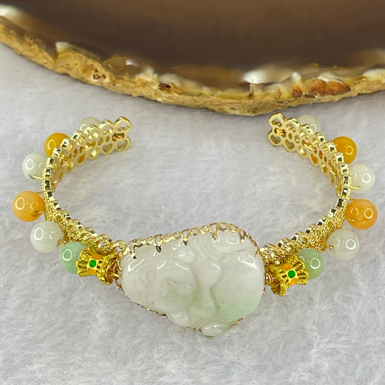 Type A Faint Green Jadeite Milo Buddha 25.5 by 25.4 by 6.7mm and Beads in Gold Color Bracelet 19.51g 6.1mm 12 Beads - Huangs Jadeite and Jewelry Pte Ltd